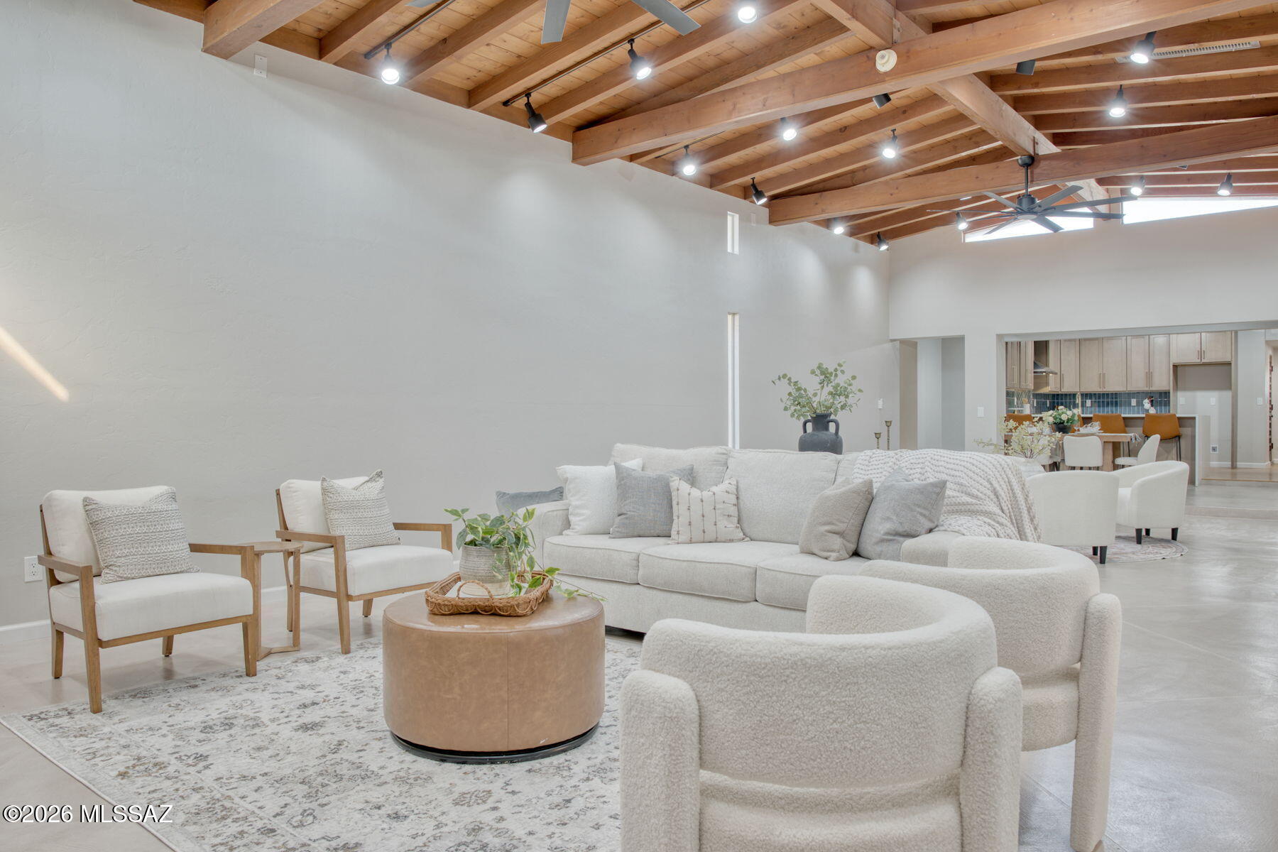 Range priced $575,000-$600,000. Seller will entertain offers within the range. Stunningly redesigned home in the historic San Clemente subdivision! Built in 1948, this elegant residence blends timeless charm with modern upgrades. Classic wood-beamed ceilings, rich wood floors, and an open remodeled kitchen with quartz counters set the stage. Custom concrete floors add character, while soaring ceilings and art-worthy spaces make this an entertainer's dream. Featuring 4 bedrooms plus an office, and 2 spa-inspired bathrooms, this rare find offers warmth, style, and function. Don't miss the large Arizona room! Perfectly located near Park Place, El Con, and Randolph Park. Covered RV parking! A true gem you won't want to miss! Seller is a licensed Arizona real estate agent.