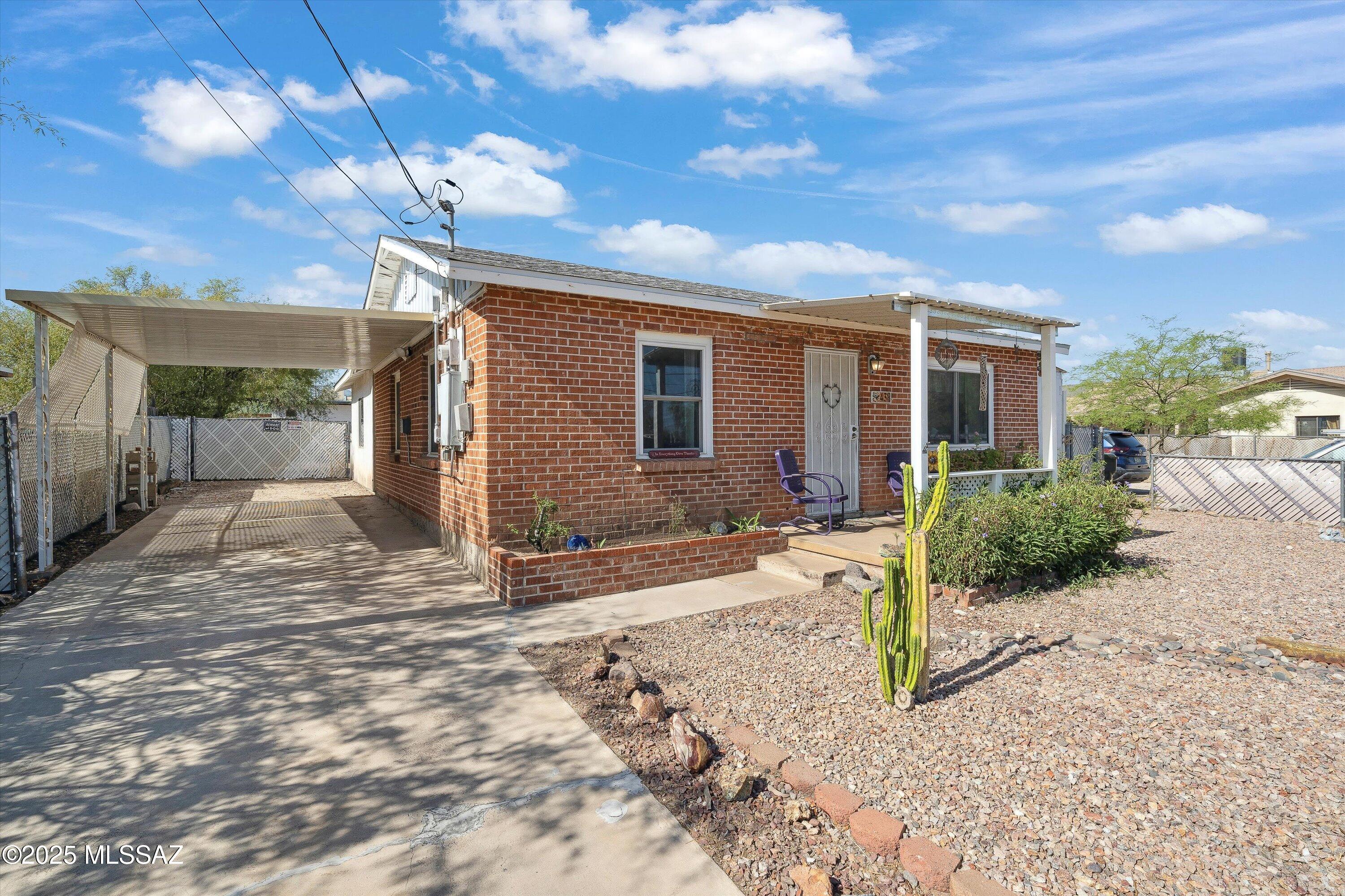 Welcome to this centrally located, charming brick home just minutes from the University of Arizona and vibrant downtown Tucson. With a thoughtfully designed permitted addition completed in 2006, this home offers flexible living space to accommodate students, professionals, or families. Perfect starter home or investment property!

Enjoy peace of mind with major updates including a brand-new roof (2025) and a modern HVAC system (2023). The home features a spacious screened patio — ideal for entertaining or relaxing year-round—as well as a large yard including exterior storage sheds for all your gear, tools, and toys. The front features beautiful, low-care natural desert landscaping.

Don't miss the opportunity to own this versatile property close to the heart of Tucson!