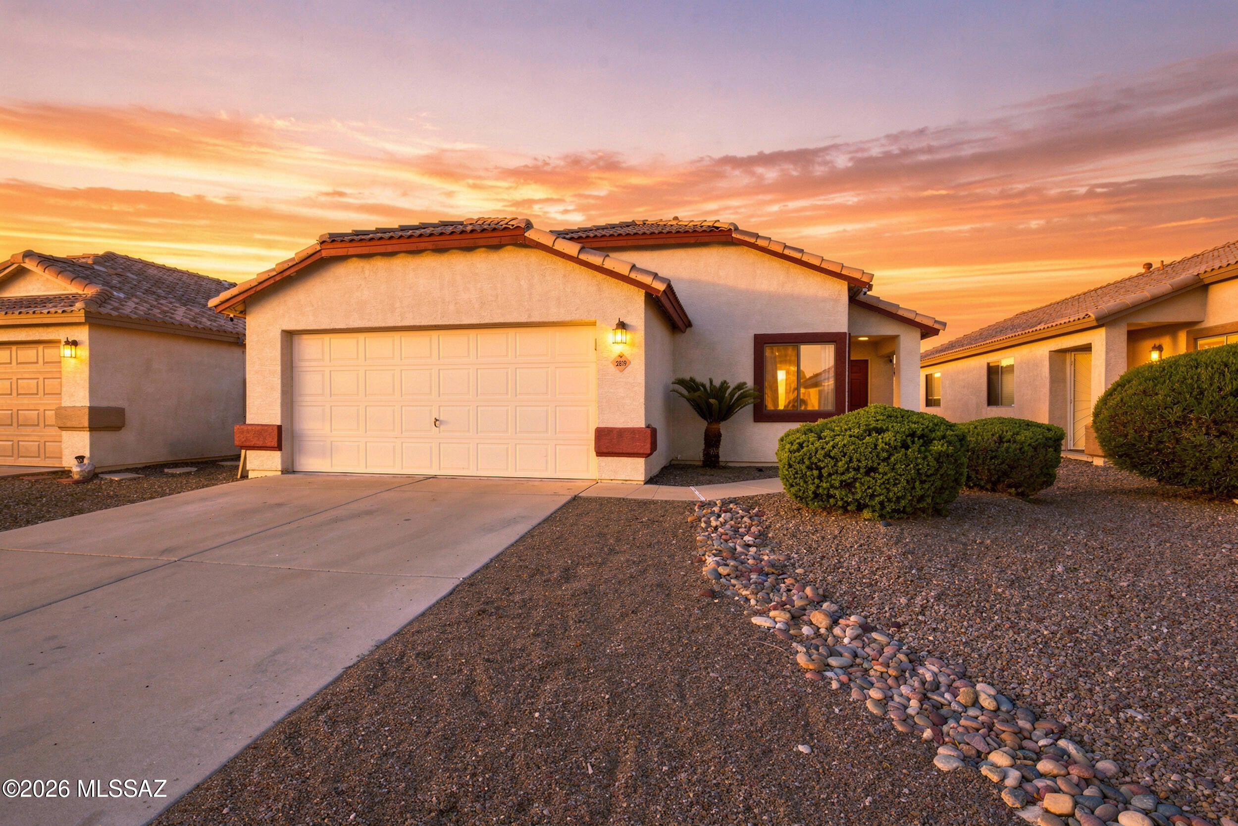 Welcome to this beautifully updated 4-bedroom, 2-bathroom home in Northwest Tucson. Vaulted ceilings, designer paint, and added can lighting throughout create a bright, modern feel. The kitchen features quartz countertops and a custom-built coffee bar with a built-in refrigerator, perfect for everyday living and entertaining. 

The primary bedroom includes a mini-split A/C, while the home also offers a newer central A/C unit for added comfort. Step outside to a private backyard featuring artificial turf, pavers, and a gas fireplace. The covered back patio is lighted with added can lights, creating the perfect space for relaxing or entertaining day or night. Thoughtfully updated and move-in ready, this home offers comfort, style, and low-maintenance indoor-outdoor living in a desirable Northwest Tucson location.