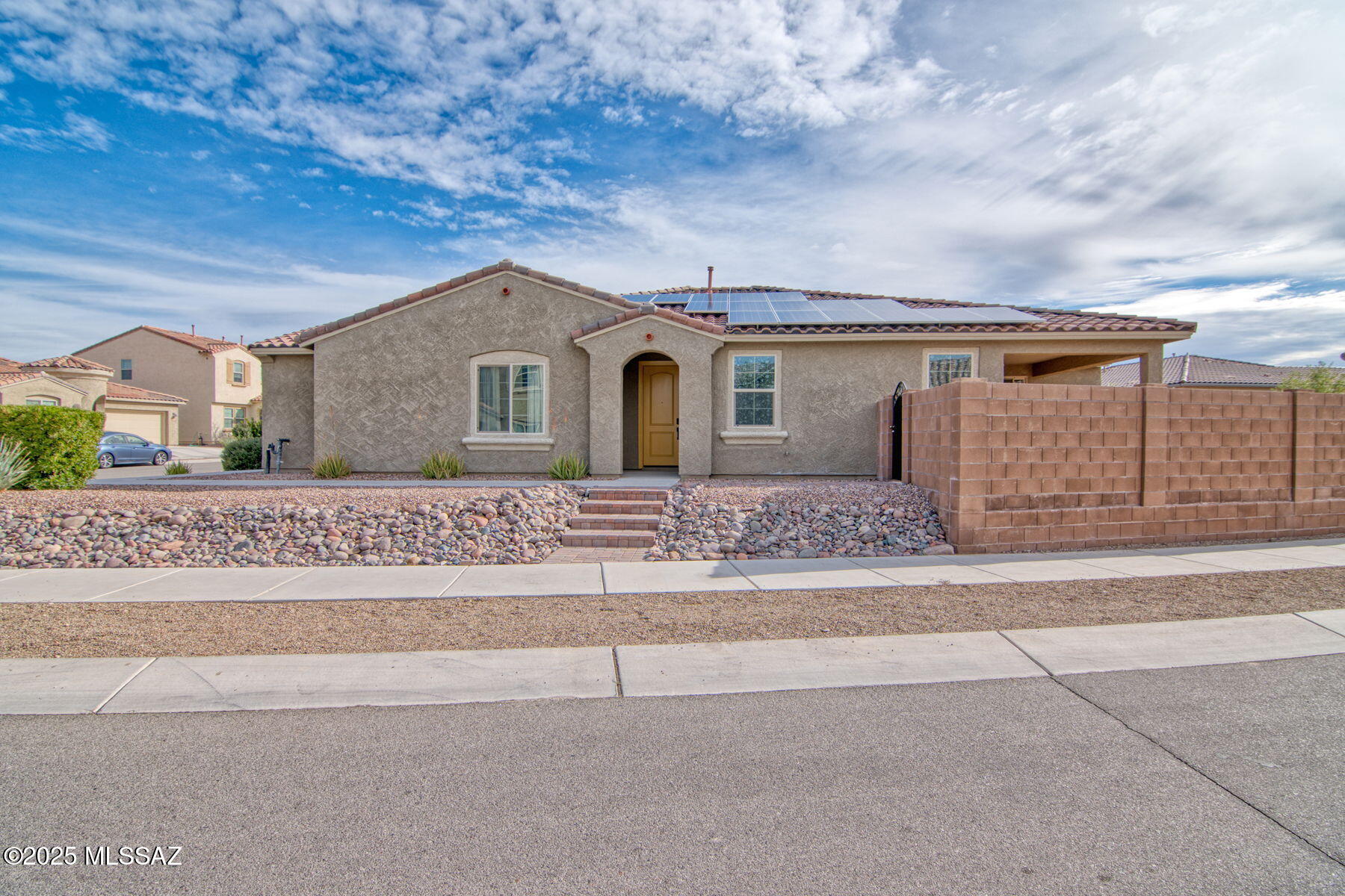 This beautifully upgraded 4 bedroom, 2.5 bathroom + den home offers modern style, thoughtful design, and incredible functionality throughout. From the moment you walk in, you'll notice the tall ceilings, expansive living spaces, and exceptional features that make this home stand out.
The gourmet kitchen is an entertainer's dream, showcasing granite counters, a huge island, custom pantry, gas range (with electric connection option), and stainless steel appliances--with the refrigerator included. A 4-panel slider in the living room and an additional slider in the dining room create seamless indoor-outdoor flow. Tile flooring extends through all common areas for easy maintenance, while the extended dining room offers extra room for hosting. The home is wired for for surround sound and includes custom ceiling fans throughout.
The spacious primary suite features a large bedroom, a custom closet, and a spa-like bathroom with double vanities, a walk-in no-threshold shower, and a rain shower head. The hall bathroom also includes double vanities, and all bedrooms come with walk-in closets.
The 2-car garage includes a tandem bay converted into a fully insulated workout/bonus room equipped with a mini-split, perfect for fitness, hobbies, or storage. Additional highlights include a soft-water loop, owned solar, custom side gate, paver patio, and plumbing for a future sink. .



Community Amenities:

Enjoy resort-style living with access to a community pool, splash pad, dog park, soccer field, basketball court, multiple play areas, and a rentable recreation room. Outdoor enthusiasts will love the proximity to Fantasy Island mountain biking trails and direct access to The Loop Tucson's 137-mile, car-free multi-use path. All located near great shopping and restaurants.
