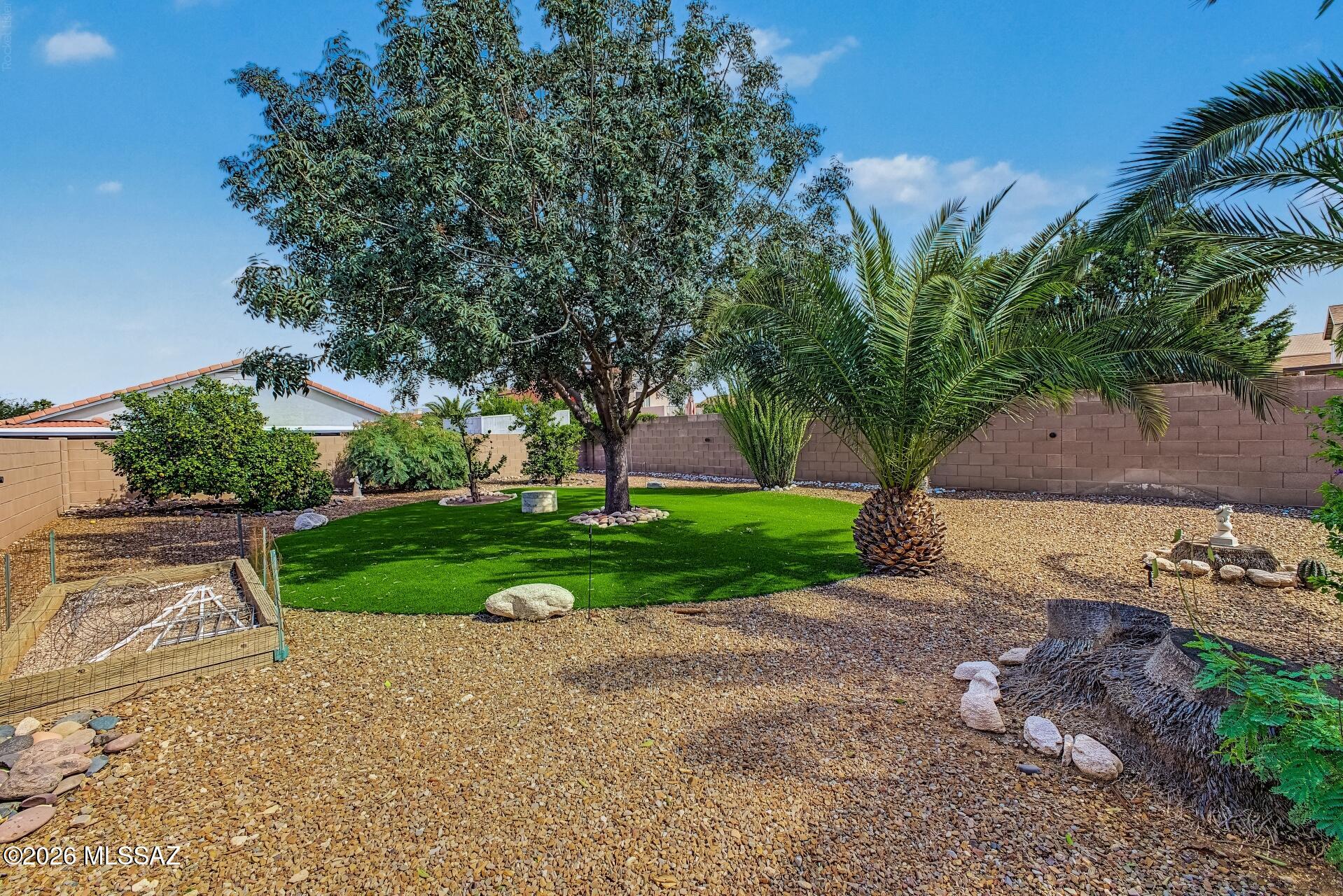 Welcome to the heart of Rita Ranch! Where curb appeal comes straight from the heart, thanks to a meticulously manicured front yard that gives this home its signature charm. Nestled in Southeast Tucson's established Rita Ranch community, 9139 E Muleshoe Street offers approximately 1,569 square feet of living space and a generously sized lot designed for enjoying Arizona's outdoor lifestyle. Step into the backyard, where an expansive artificial turf area, four varieties of citrus trees, and a mature shade tree create an inviting outdoor retreat. Gather around the Kiva fireplace with built-in seating for cozy evenings under the desert sky, or simply relax and enjoy your own backyard oasis. Conveniently located near parks, shopping, dining, and commuter routes, with access to the Vail Unified School District, this home brings together comfort, convenience, and personality. Come discover a home that you'll fall in love with from the moment you drive up!