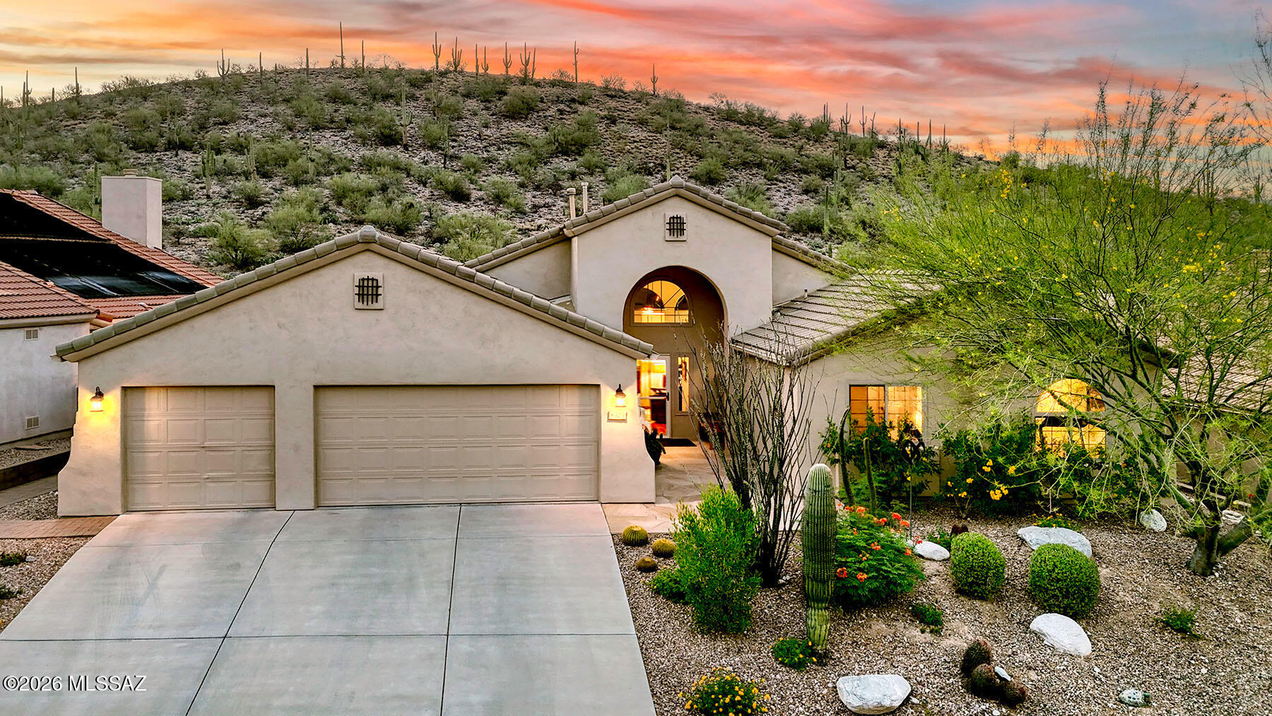 Welcome to the highly sought-after gated community of Sabino Mountain in North Tucson, where privacy, natural desert beauty, and stunning views come together. Nestled close to town yet surrounded by abundant wildlife, this beautifully remodeled and meticulously maintained 4-bedroom, 2Â½-bath home offers a rare combination of convenience and tranquility. Perfectly positioned against Sabino Mountain, the property enjoys breathtaking natural desert views, peaceful surroundings, and the unique benefit of the nearby mountain providing cooling shade and beautiful delayed sunrises.  Located in a quiet, friendly, and well-managed gated community, residents enjoy peace of mind and an exceptional quality of life. The flexible 2,302 sq. ft. floor plan features both a formal living room with dining area and a separate family room with fireplace, along with new windows in 2024.  Designed for both style and functionality, the remodeled kitchen showcases designer cabinetry, stainless steel appliances, Quartz countertops, a custom tile backsplash, gas cooktop and range, a center island with breakfast bar, inviting breakfast nook and pendant lighting.  The spacious primary suite serves as a peaceful retreat, featuring a sliding glass door that opens directly to the backyard patio for seamless indoor-outdoor living. The luxurious primary bathroom includes dual sinks, walk-in closet, a separate shower, and a relaxing jetted tub. Throughout the home, you'll find gorgeous wood flooring, newer carpet, and thoughtful updates that reflect pride of ownership. A spacious three-car garage with built-in storage cabinets provides excellent organization and functionality.  One of the home's standout features is the screened porch with a retractable screen that can be opened frequently to enjoy the fresh air, desert breezes, and serene surroundings. The wonderful rear patio offers additional possibilities for enclosed outdoor living, while the beautifully landscaped backyard is ideal for relaxing or entertaining in Tucson's stunning desert setting.  Residents of Sabino Mountain enjoy outstanding community amenities including a recreation center, year-round heated pool, spa, and clubhouse, all surrounded by the spectacular Sonoran Desert landscape while remaining conveniently close to North Tucson shopping, dining, and recreation.