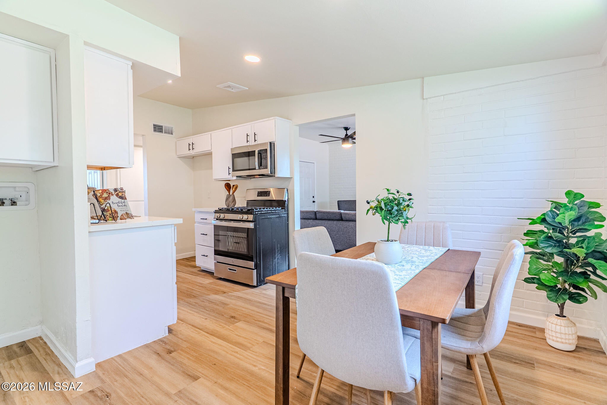 Welcome to the home you've been waiting for! Completely remodeled from top to bottom, this stunning 3-bedroom, 2-bath home blends modern style with everyday comfort. Step inside to an open, light-filled floor plan featuring luxury vinyl plank flooring, fresh paint, recessed lighting, and designer finishes throughout. The gorgeous kitchen offers white shaker cabinetry, quartz countertops, stainless steel appliances, and sleek black fixtures. Both bathrooms have been beautifully renovated with custom tile showers and contemporary finishes. Outside, enjoy a spacious backyard with a covered patio, storage shed, fire pit, and endless possibilities for entertaining. Conveniently located in South Tucson with easy access to downtown, I-10, shopping, and dining.