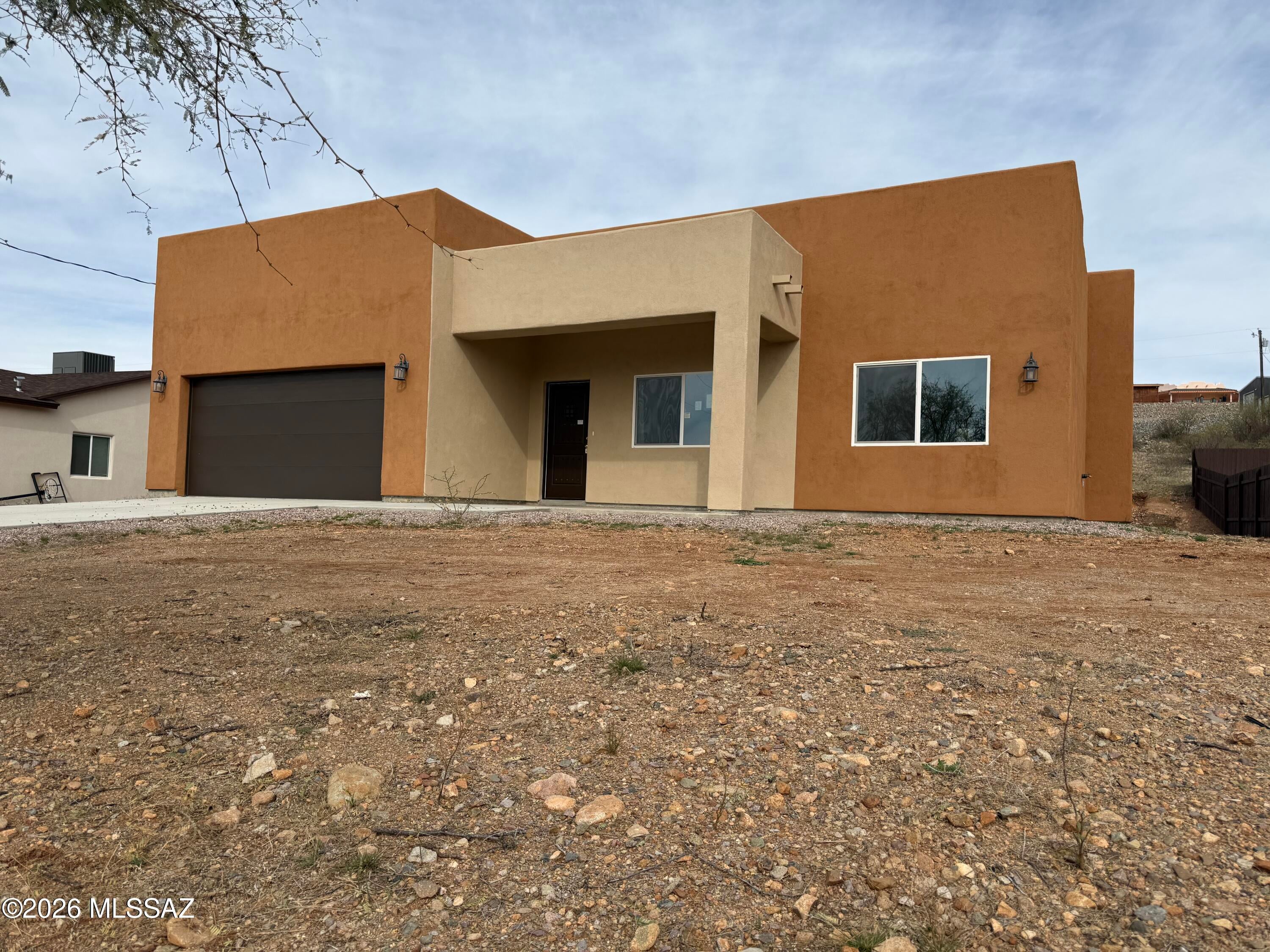 This lovely home is ready for new owners. This home is barely lived in so why buy new? This home has an open floor plan as well as a split plan. The kitchen has a wonderful island with breakfast bar and granite counters. The master suite includes a large walk in closet as well as a large walk in shower. The secondary bedrooms are good sized and there is a well appointed 2nd bath for them to share.  The back yard has a covered patio to enjoy our near perfect weather. Do not miss this home.