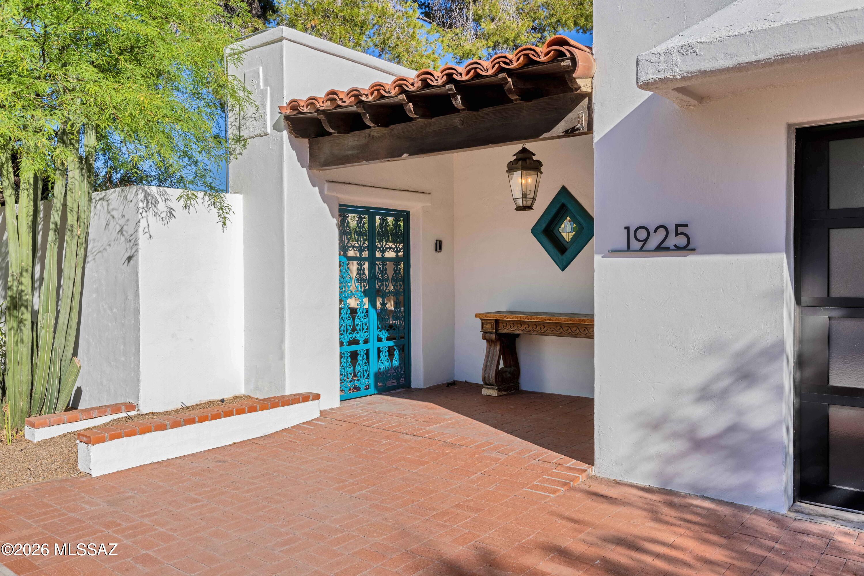 This extraordinary estate presents a rare opportunity to own a distinctive multi-residence property in one of Tucson's most desirable historic neighborhoods of Blenman Elm-all within a fully enclosed gated private enclave. Built in 1937, the main residence offers 3 Bd/3 Bth-3008 sq ft of refined living space, highlighted by two fireplaces, a wine cellar & its own detached two-car garage. A second 1183 sqft residence provides 2 Bd/1Bth +fireplace & detached two-car garage-ideal accommodations for extended family, guests, or private living quarters. Enhancing the estate is a newer sparkling solar-heated pool & a charming detached 550-sqft 1 Bd/1 Bth guest quarters w/beehive fireplace. An addtl' private 171 sq ft studio space provides remarkable flexibility for guest, office or creative work. The property also includes an additional Studio/Rec Room of 250 sq ft right off the pool. Additionally on the property is a 225 sq ft storage room behind one of the detached garages AND a fully enclosed RV storage space, ensuring exceptional functionality rarely found in historic properties. These 2 additional buildings are NOT currently heated/cooled space so not included in the overall 4912 square footage. They both do however have electricity and overhead lighting.
Outdoor living is equally impressive. Multiple courtyards and patios create intimate gathering spaces throughout the grounds, while a beautifully designed outdoor kitchen anchors a vibrant entertaining area with multiple seating spaces, huge shade structure, mature landscaping, alfresco dining, and an outdoor fireplace--perfect for enjoying Tucson's year-round sunshine.
The property also qualifies for historic tax benefits, adding further value to this remarkable offering.
Ideally located just steps from the Arizona Inn, Banner University Medical Center, and the University of Arizona, this one-of-a-kind compound combines historic charm, privacy, and unmatched versatility in an exceptional central Tucson location.
This is a property that truly must be experienced in person to appreciate its scale, character, and possibilities.
The two parcels and addresses are being sold together only.