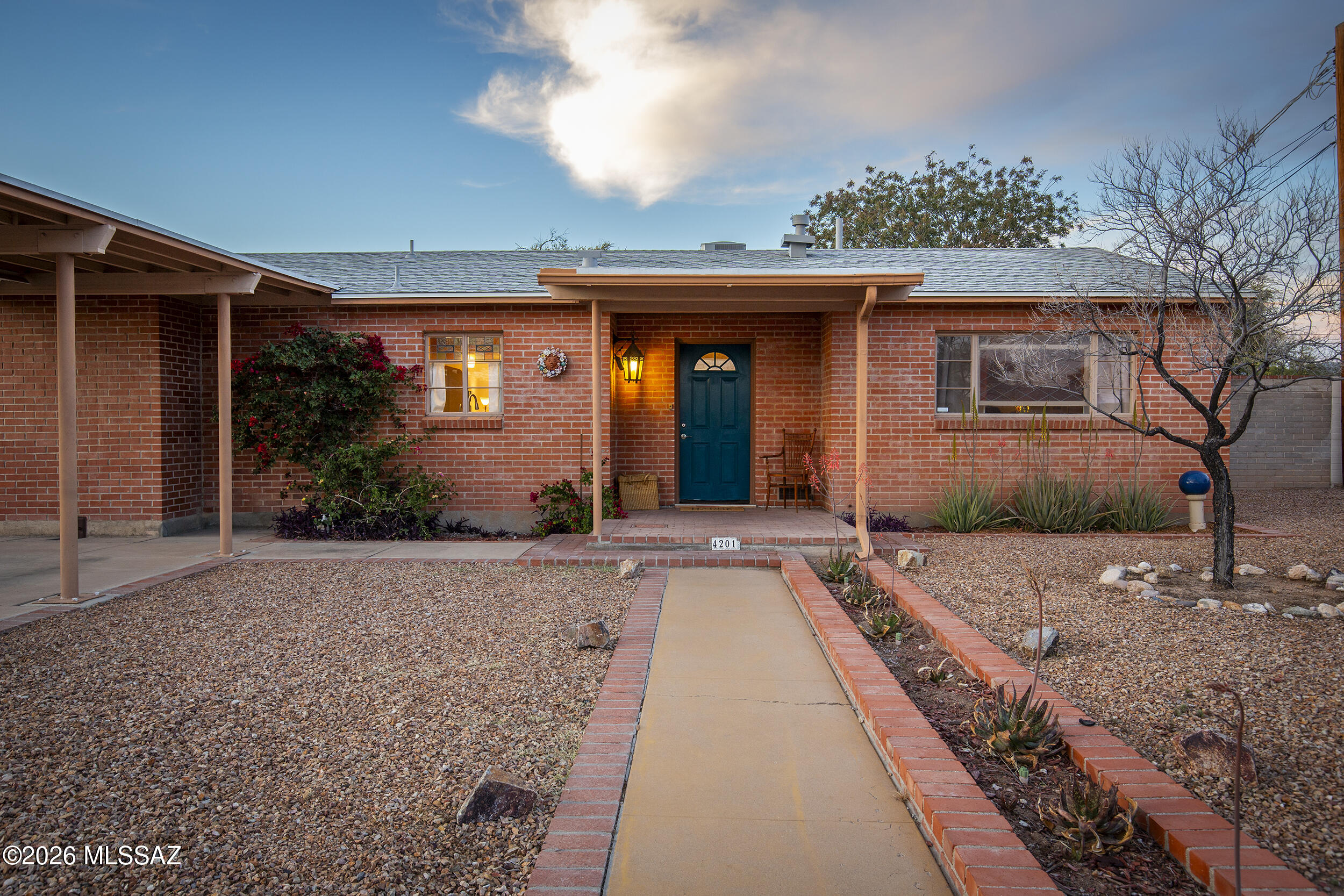 Welcome to the Poet's Corner enclave of the charming Peter Howell neighborhood, beloved for its Mid-Century charm and proximity to mid-town amenities. This thoughtfully updated home blends modern comforts with the warm, unmistakable character found in classic Tucson homes. Recent upgrades include a Brand New Roof (Shingled and modified bitumen flat sections), New Ceramic Tile throughout, New HVAC, Plus a Mini-Split. New Dishwasher and New Microwave. New Light Fixtures and Ceiling Fans in every room. Original charm is nuanced in arched doorways, coved ceilings, built-in cabinetry, stained glass accents, and a Wood Burning Mid-Century Fireplace with a Bespoke mantel. The spacious primary bedroom includes an en-suite bathroom and a sizable attached bonus room-currently used as a Media Lounge. The Primary Suite offers additional living space, perfect for TV room or sitting room.  

Step outdoors (backyard access from Primary Suite and AZ room) to a large backyard offering flexible spaces for Outdoor Dining, Gardening, and entertaining. A finished, air-conditioned workshop (or potential office or studio space), complete with its own enclosure, adds even more possibilities for hobbies, creative work, or storage.

You'll love this location: it's just a short walk to Locale for morning coffee, weekend brunch, or an elevated dinner. Midtown restaurants and shopping are minutes away, and the historic Sunshine Mile district is also close at hand. The home sits just 3 miles from the University of Arizona, and only 4 miles from downtown- offering quick access to everything from arts and culture, to major medical and employers.

Half a mile away is Gene C. Reid Park, Tucson's iconic recreation hub: run or walk the scenic 2-mile path, play one of two 18-hole golf courses, visit the Reid Park Zoo, wander the rose garden and duck pond, or take your dog to Miko's Corner Playground for off-leash fun. The Edith Ball Adaptive Recreation Center offers year-round swimming and wellness programs.

This home is move-in ready with quality, thoughtful, and significant updates/upgrades already completed, while still maintaining its personality, charm, and flexible living spaces. It's ready for you to make it your own dream home!