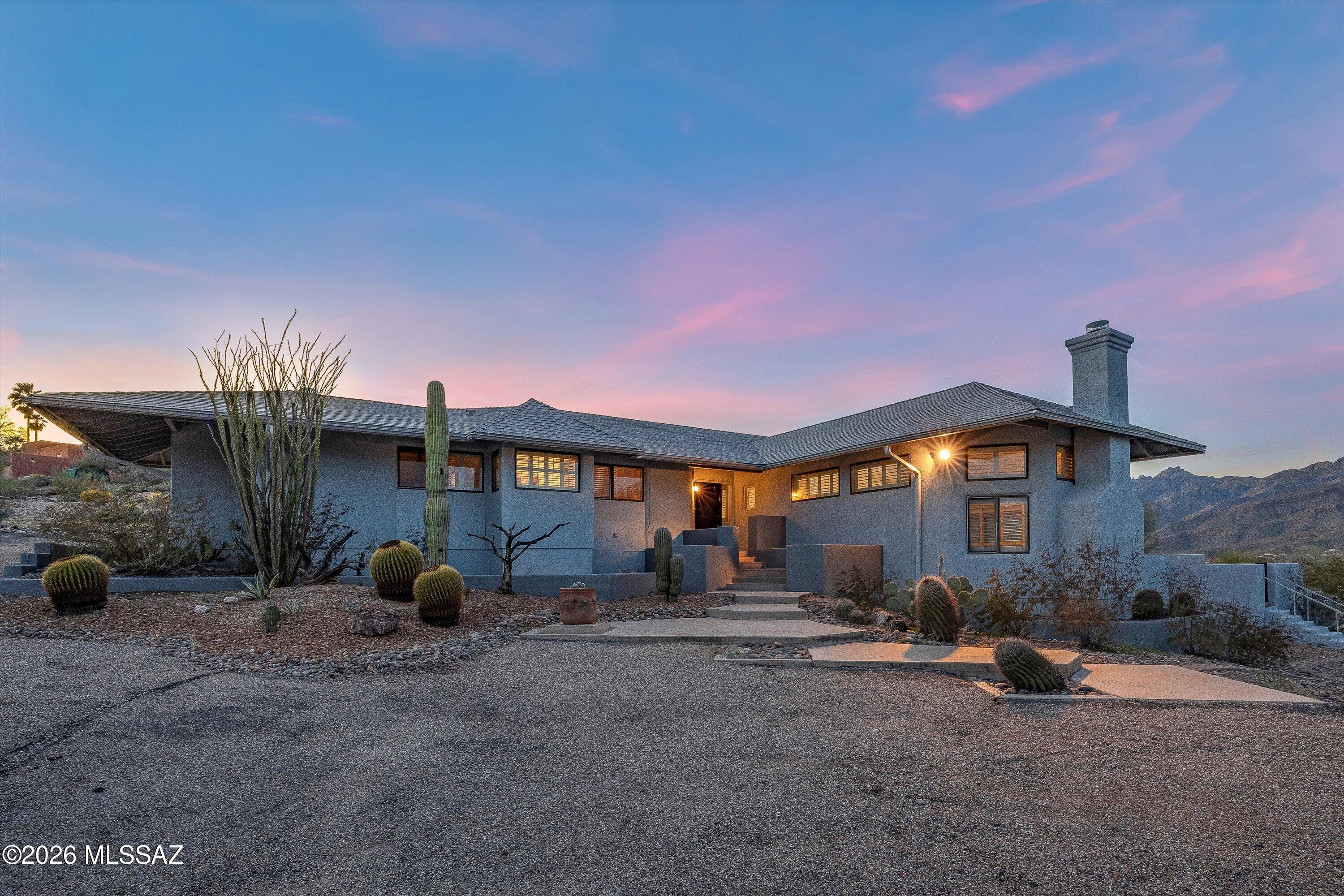 VIEWS, VIEWS, VIEWS!!! Ridgetop contemporary on 1 acre corner lot with unobstructed, up close, Rincon & Catalina Mtn views from every room near Houghton/Snyder in NE Tucson close to McDonald Park, AZ National Golf Club, Sabino High School, library, shopping, restaurants & Mt Lemmon. Main Home has 3 bedrooms (split plan) & 2 baths plus a SEPARATE 10 x 20 Guest qtrs/office/Bedroom/studio w/bathroom. Updated kitchen w/huge window over sink looking out to Catalinas. One bedroom has custom knotty pine desk & bookcases used as an office. Vaulted ceilings & plantation shutters thruout, 3 separate flagstone patios, oversized 2-car garage with workshop area, whole house generator, Heating & A/C unit is 3 years old.  Another Diamond in the Desert!