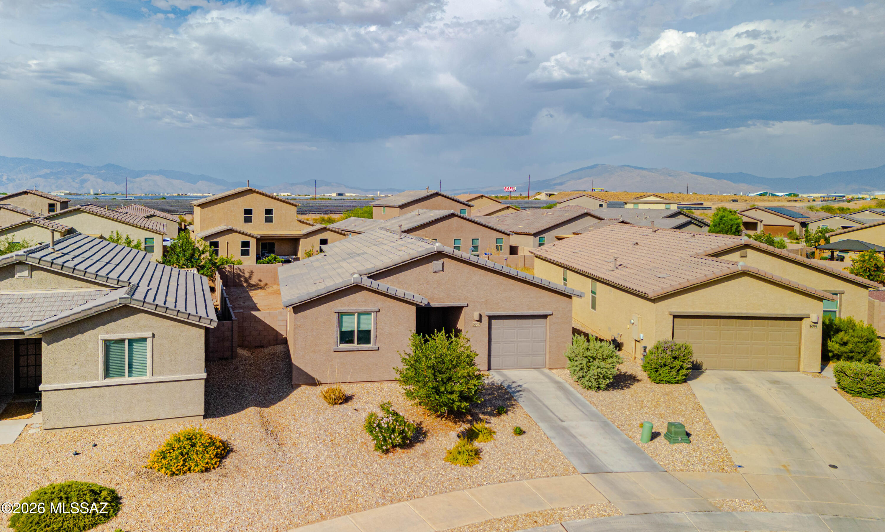 Location, location, location!  Welcome to this immaculately clean and beautifully maintained single-story home built in 2022, with a massive backyard, minutes from Interstate-10 and walking distance (paved access!) to the Chuck Huckleberry Loop!  A long driveway brings you to this lovely two bedroom, one bathroom, one car garage home with inviting and easy-care landscaping with irrigation in front.  Inside, an open floor plan welcomes you with a spacious kitchen with stainless steel appliances, gas range, tons of cabinet and countertop space, reverse osmosis drinking water, and views of the neighborhood open space and community park from the kitchen window.  A large living area and hallway brings you to two generous sized bedrooms and full bathroom with executive height vanity and bathtub/ shower combo.  Large laundry room comes with washer and gas dryer, and plenty of storage space! But don't forget about the lot: This massive backyard is a blank slate, with plenty of room for a pool!  And this energy-efficient home also comes fiber internet, plus smart features, dimmer switches, and natural light throughout!  Your commute will be a breeze with easy access to Interstate-10, Amazon, Raytheon, the University of Arizona, Downtown Tucson, and paved access to The Loop!  Welcome home!