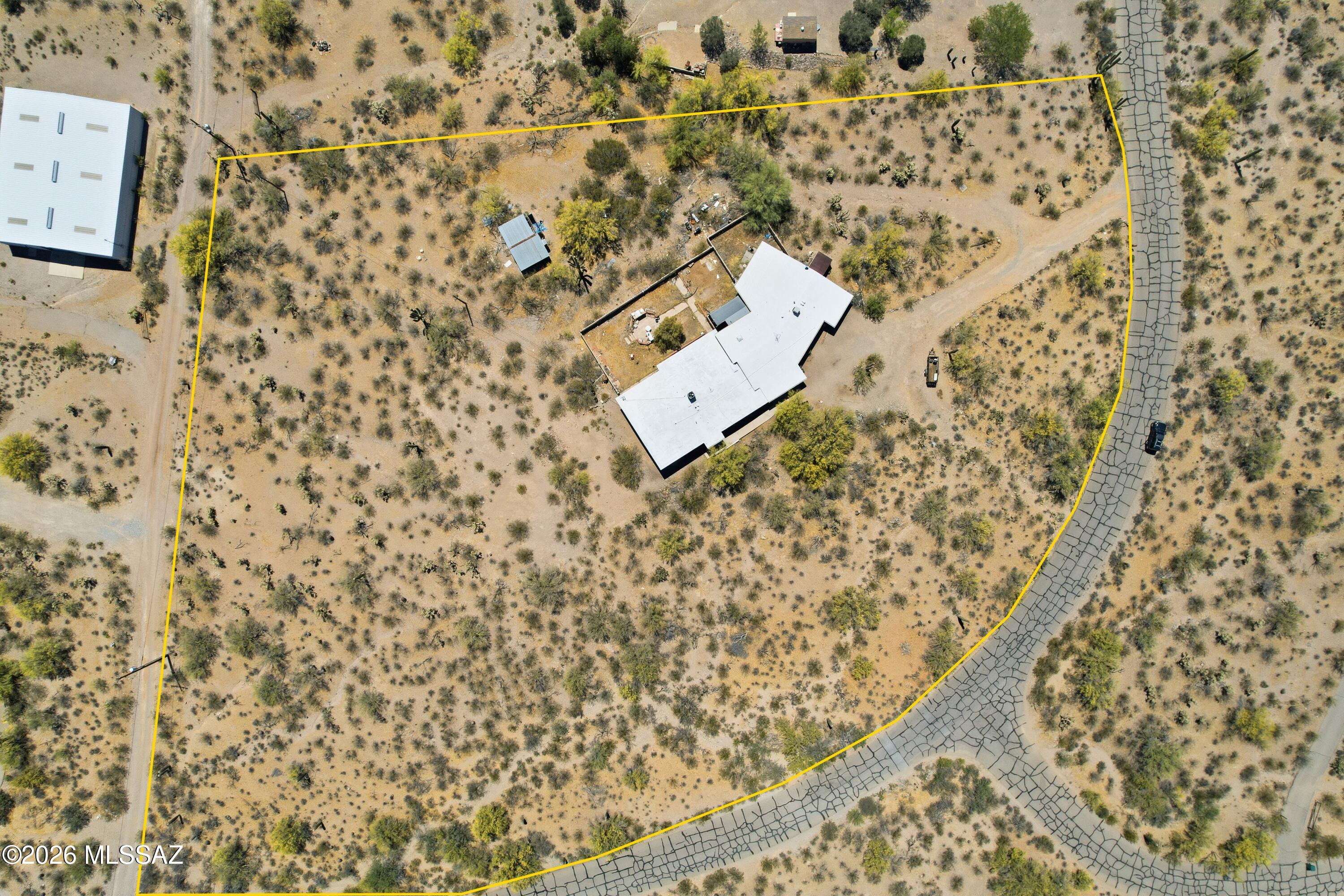 Welcome to this Tucson Mountains home, perched on a hilltop in the Ranchos De Oeste community. 3+ acres & 3k+ square feet of combined living space between the main home and the attached guest house. The functionality to accommodate a large family or a split bonus rental unit. The possibilities are bountiful for this home that needs some updating and new life, this is offered with that in mind. Zoned Pima SR, this offers a wide variety of land uses that you can investigate, including uses for livestock and agriculture. The views are stunning, the stars are bright and the neighbors are not too close. We are more than happy to schedule a showing for you.