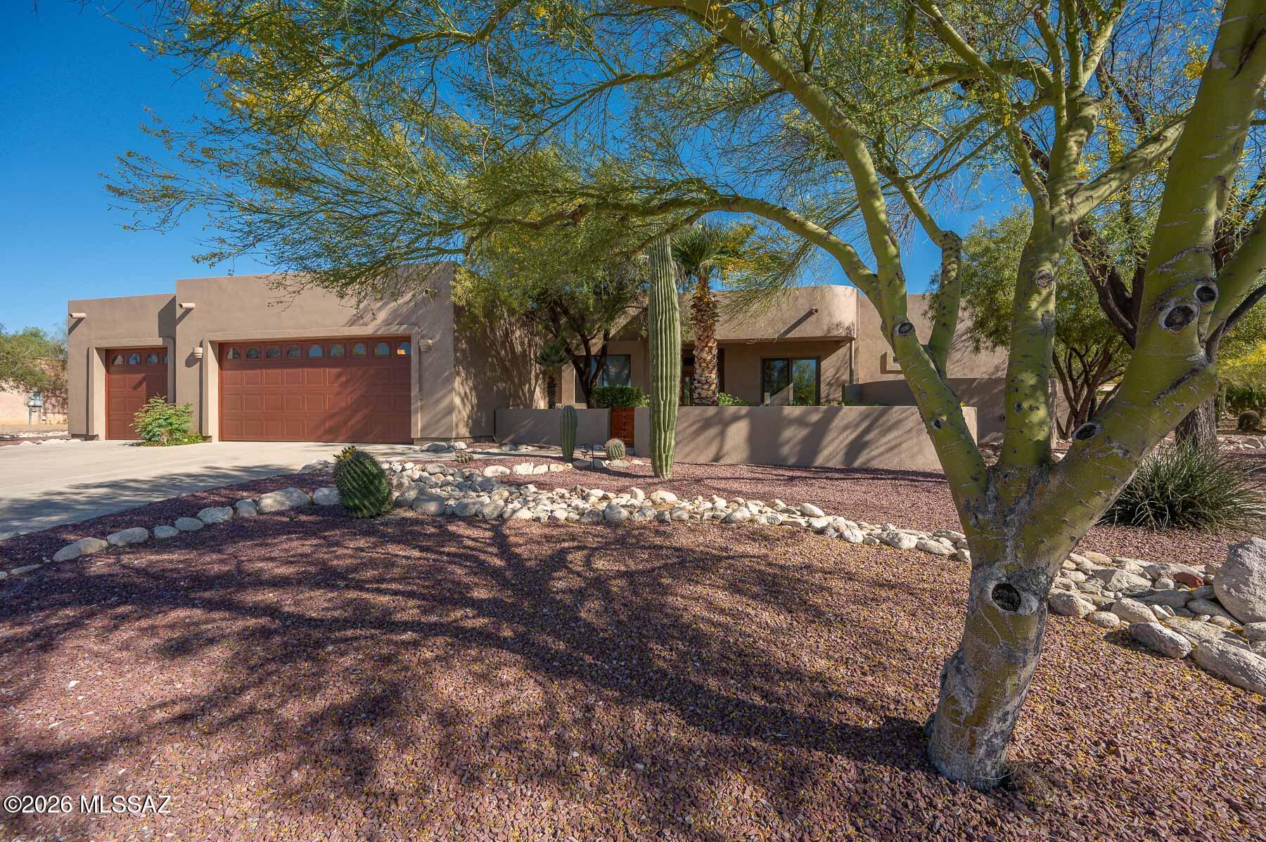 Located in secluded Sabino Vista Hills, offering privacy and quick access to shopping, dining, and outdoor activities. Welcoming front-entry courtyard features elevated seating. Discover an inviting split floor plan that features an extra-large fourth bedroom, perfect for guests, home office or exercise room. The open great room flows toward a spacious covered patio, ideal for outdoor living and entertaining. Cozy up by the kiva fireplace on cool evenings or enjoy the generous backyard--ready for a private pool, guest house, or a second garage. Recent updates include newer HVAC units, new roof, water heater, quartz countertops, recently tiled walk-in shower and fresh exterior paint, ensuring comfort and peace of mind.  The neighborhood provides a large pool, wading pool clubhouse, tennis, pickleball, youth swim team, and access to walking trail from your front door.  Additional features:  Anderson low E windows & doors, pop-up outlet/charging station in island, sound system to 2 rooms & patio, private backyard, 3-car garage.