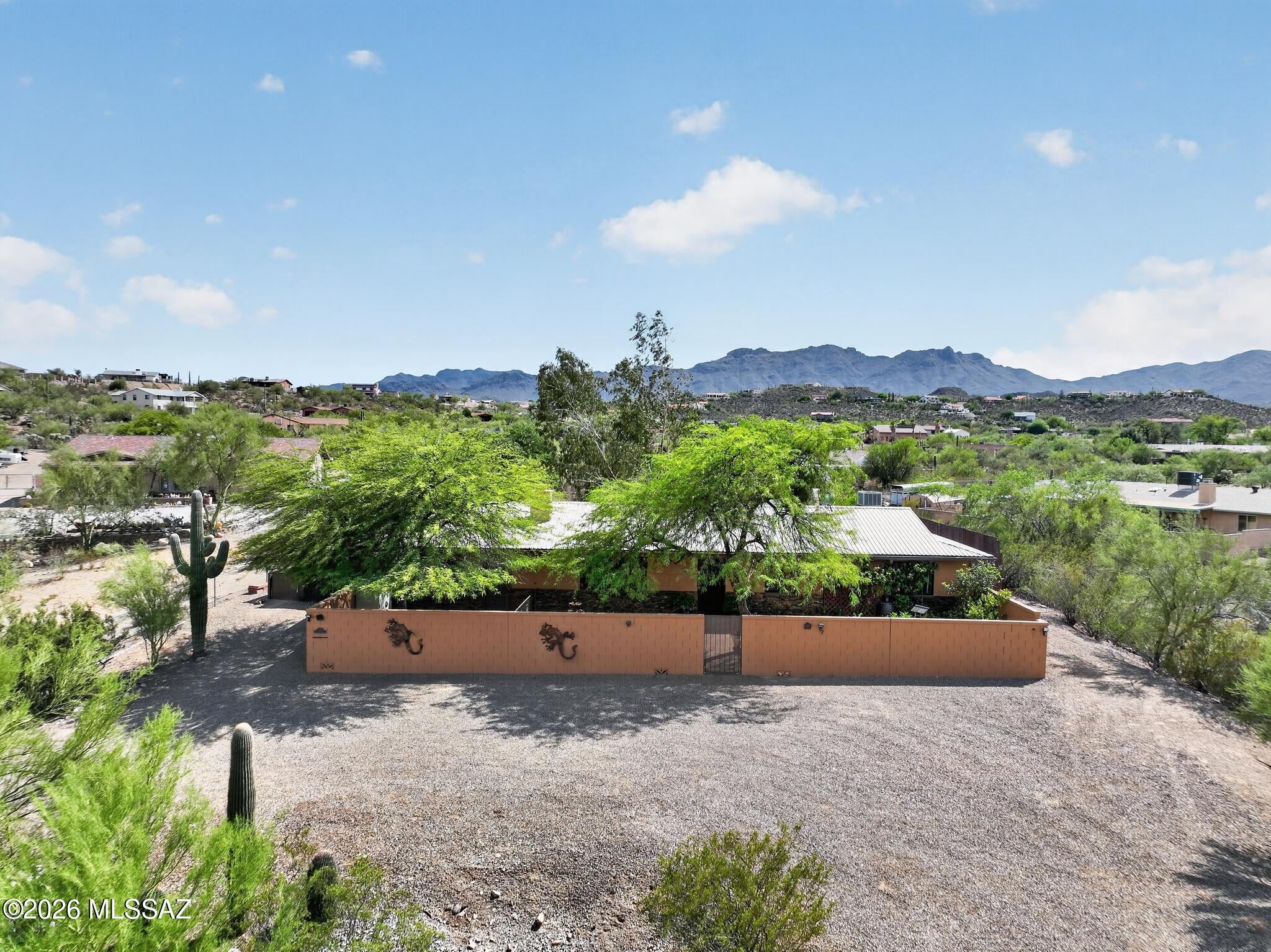 Beautiful 3 Bedroom, 3 Bath house with guest quarters and a custom pool and spa. This amazing property is nestled in a cul-de-sac on the West side of Tucson. Amazing views of the mountains and sunset. The property is situated on over an acre so plenty of room for all your vehicles and toys. The backyard is an oasis filled with a beautiful landscape of pavers, lime, lemon, and orange trees. Custom pool and spa includes a private shower and Ramada for all your entertainment needs. Granite counter tops and new cabinets in the kitchen. Stone veneer custom wall in the great room. The guest quarters are completely separated from the main house and have their own entrance. All appliances, patio furniture, and plants convey with the sale of the property.