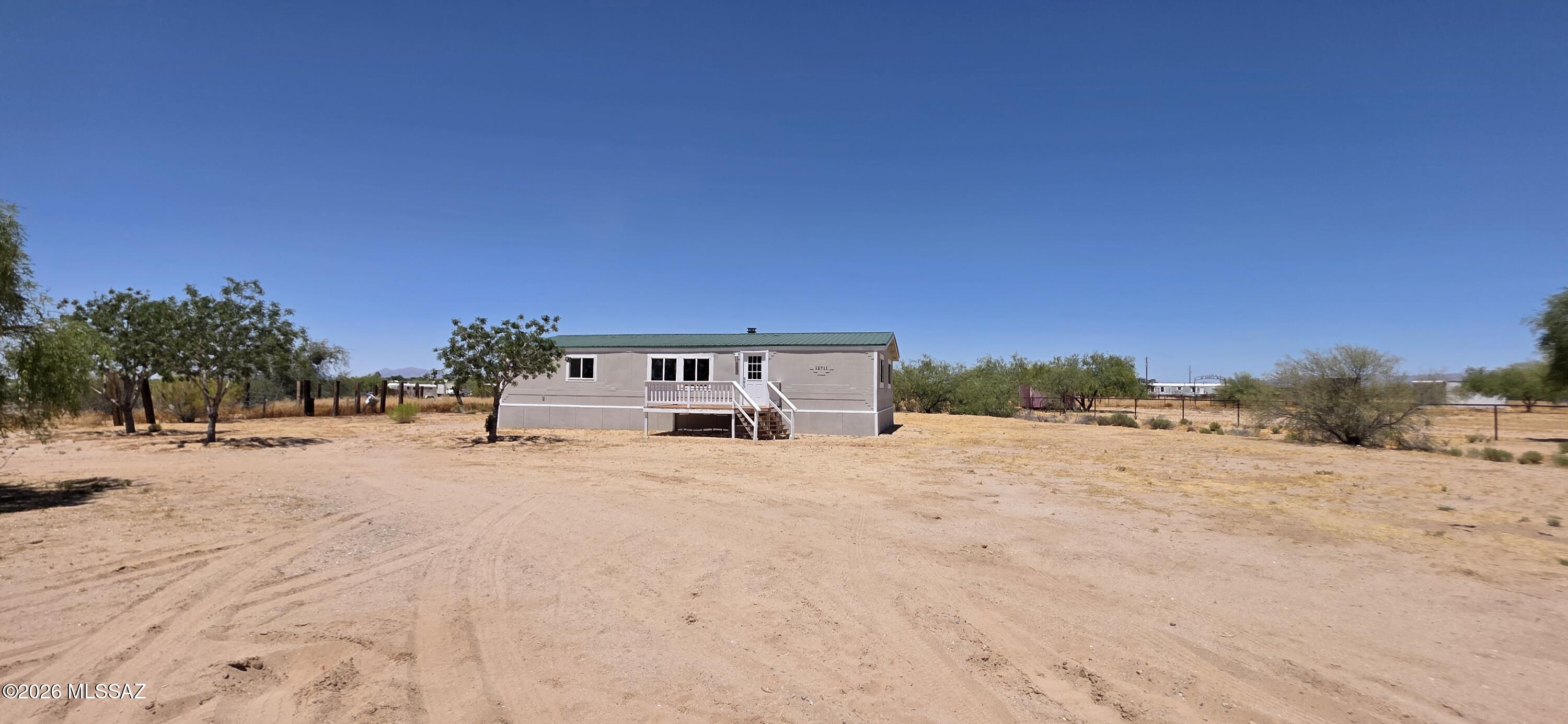 Great opportunity for affordable homeownership! Spacious manufactured home situated on a full acre in Marana. Features 3 bedrooms, 2 bathrooms, and a versatile bonus room ideal for a den or home office. Zoned for horses and perfect for those seeking a relaxed rural lifestyle. A must-see!