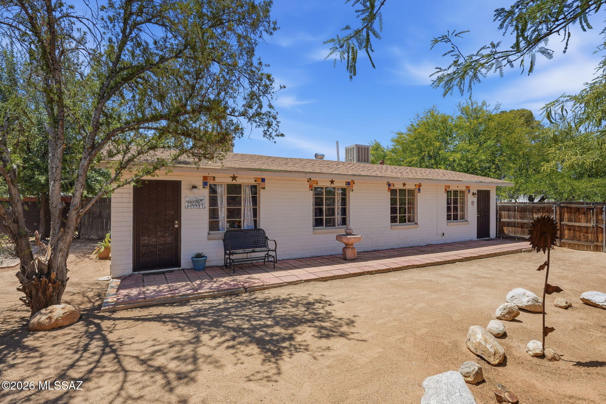 One-of-a-Kind Central Tucson Property! This 2-bed, 2-bath home offers a truly unique living experience. Originally designed as two 1-bedroom townhomes, the residences were thoughtfully combined to create one spacious home filled with character and charm. A large fenced in property features desert landscaping w/beautiful mountain views, 2 sheds w/electricity, heating/cooling provide exceptional flexibility as workshops, hobby rooms, studios, or additional storage space. Inside, you'll find fresh interior paint, classic Saltillo flooring, the enclosed sunroom converted into the kitchen, plus an additional screened patio. From its distinctive history to its versatile outdoor spaces, this home is packed with personality and possibilities. The charm and uniqueness must be seen to appreciated! From its distinctive history to its versatile outdoor spaces, this home is packed with personality and possibilities. The charm and uniqueness of this property must be seen to be fully appreciated!