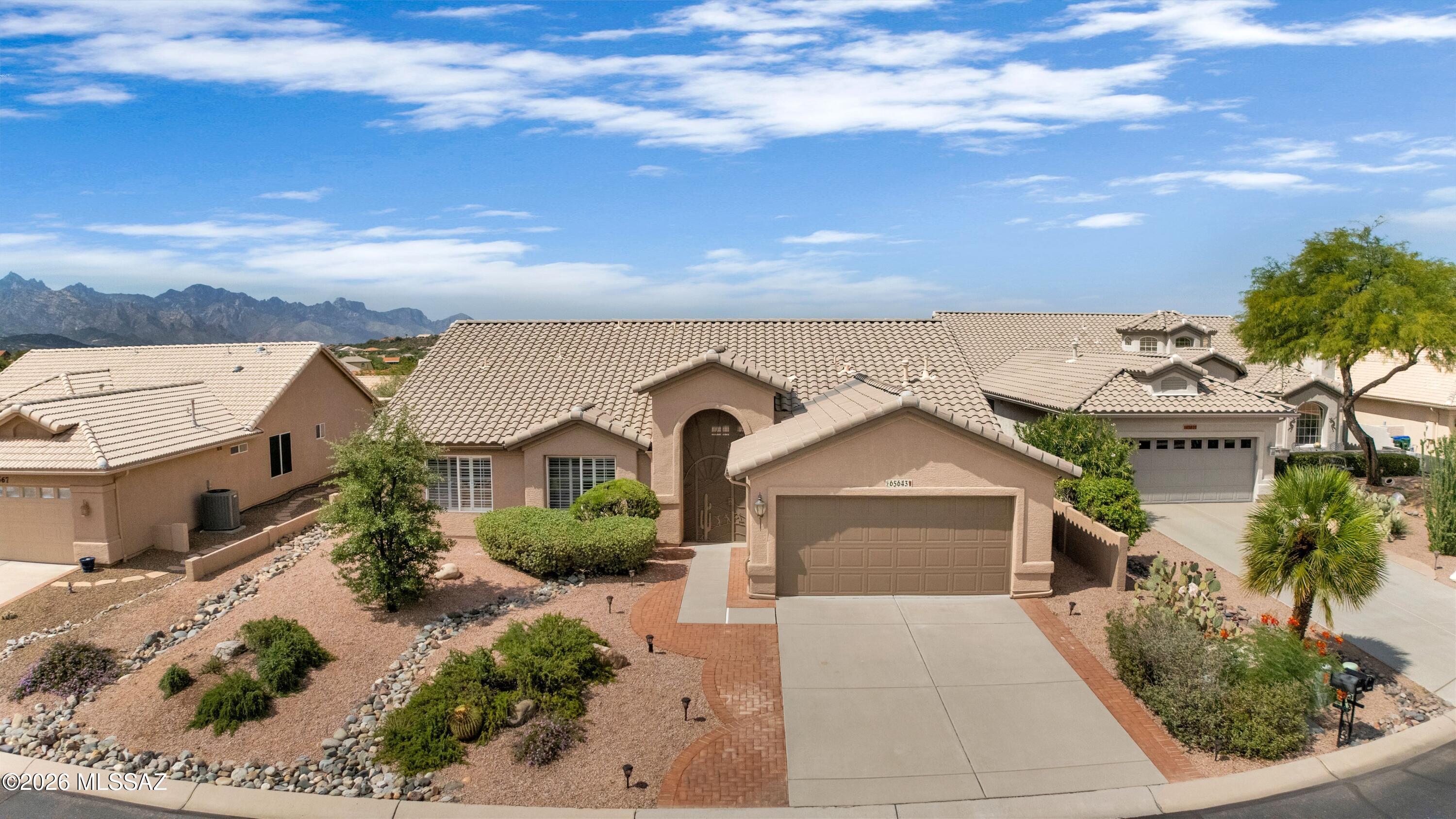 Sedona on cul-de-sac with southern mountain views! ''Roof Underlayment Replaced, Exterior House Painted & Interior House Painted 7/2026!'' Wrought-iron entry gate & inviting foyer. Great Room & Dining Area with sliders to patio. Kitchen has white appliances, gas range, abundant counter space, island, cabinets, kitchen nook area & walk-in pantry. Den/Office with privacy doors. Owner's Suite features an ensuite bath with walk-in shower, soaking tub, & dual closet. Guest bedroom with closet & nearby full bath. Plantation shutters & central vacuum system. Laundry room with W/D & cabinets. Extended 2-car garage with utility sink & cabinets. Covered paver patio that extends to paver seating area with flower beds, lovely landscaping, & gated backyard. Mountain views to enjoy sunrises & sunsets!