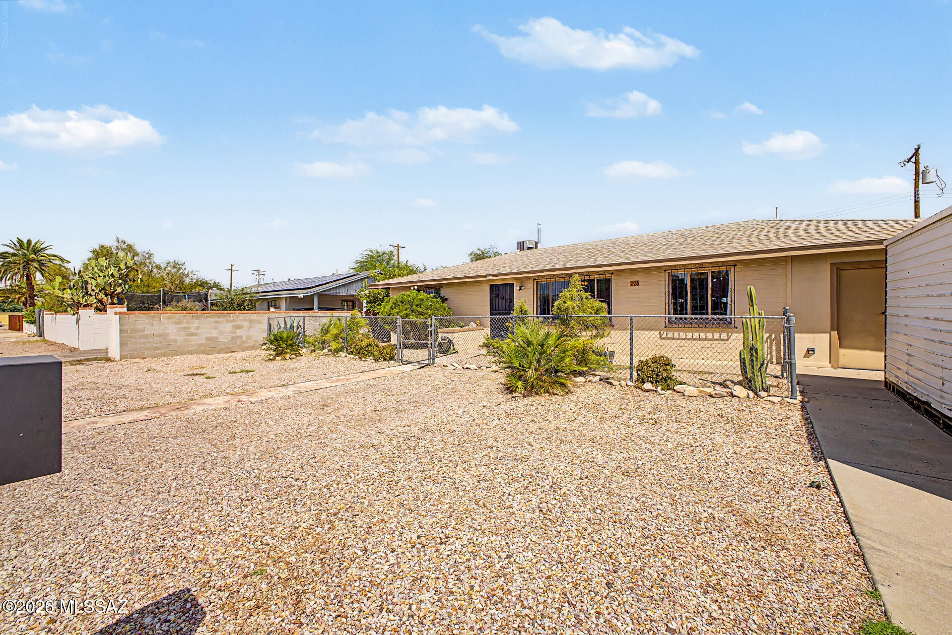 Motivated seller offering concessions and a 3.1% assumable VA loan for qualified buyers! This 3-bedroom, 2-bath gem offers comfort, functionality, stunning mountain views, no HOA, and a convenient location less than 5 miles from the University of Arizona. The inviting living room features crown molding, a soothing color palette, and easy-care tile flooring. The kitchen offers granite countertops, abundant wood cabinetry, and built-in appliances. An enclosed Arizona room adds living space, while the bonus room/workshop with separate built-in office offers endless possibilities for hobbies, projects, or remote work. Generous storage and a spacious backyard complete this versatile home.