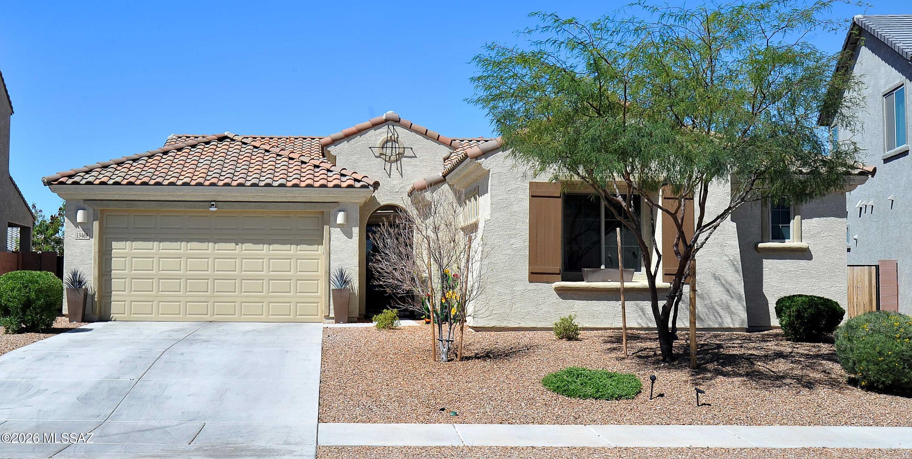 This newer 4 bedroom, 4 bathroom  Model-perfect home is loaded with upgrades,. This stunning home truly has it all. The beautifully landscaped backyard offers a covered patio, extended brick paver patio, artificial turf, and breathtaking mountain views--perfect for relaxing or entertaining.
The incredible chef's kitchen features custom cabinetry with crown molding and hardware, quartz countertops, a stylish tiled backsplash, and a large island with seating for four and pendant lighting. Additional highlights include a pantry, undermount sink with spray faucet, and stainless steel appliances including a French-door refrigerator with water and ice dispenser, built-in oven and microwave, gas cooktop, and stainless steel hood system. Additional upgrades throughout the home include upgraded tile flooring, gas stub for outdoor BBQ, extra recessed lighting, built-in speaker system, custom paint, tankless water heater, abundant windows that provide exceptional natural light and a gated front courtyard.

The popular open floor plan features a spacious family room that flows seamlessly into the kitchen and dining/flex space, along with a desirable split-bedroom layout. A private multi-generational suite offers its own bedroom, living area, and bathroom--ideal for guests or extended family. The oversized laundry room includes a utility sink and overhead shelving for added convenience.

The expansive primary suite features a luxurious bathroom with an extended walk-in shower with multiple shower heads, glass enclosure, and tile to the ceiling, along with a dual vanity with quartz countertops, undermount sinks, and upgraded modern fixtures.
Residents enjoy the outstanding Rocking K community with resort-style amenities including 8 lighted pickleball courts, walking paths, sports and soccer fields, a lighted basketball court, playgrounds, covered play areas, and a community gazebo.