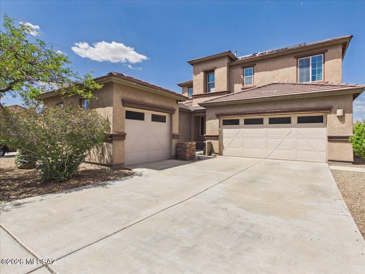 Located in the sought-after Vail School District, this beautifully maintained home offers the perfect blend of space, comfort, and functionality. Featuring 4 bedrooms, 3 bathrooms, multiple living areas, and a versatile downstairs bonus room or office, there's room for everyone. The chef-inspired kitchen showcases stainless steel appliances, double ovens, a gas cooktop, oversized island, and walk-in pantry. Upstairs, the spacious primary suite includes a custom walk-in closet and spa-like tiled shower. Step outside to enjoy a low-maintenance backyard with turf, a cozy fire pit seating area, and peaceful desert views.