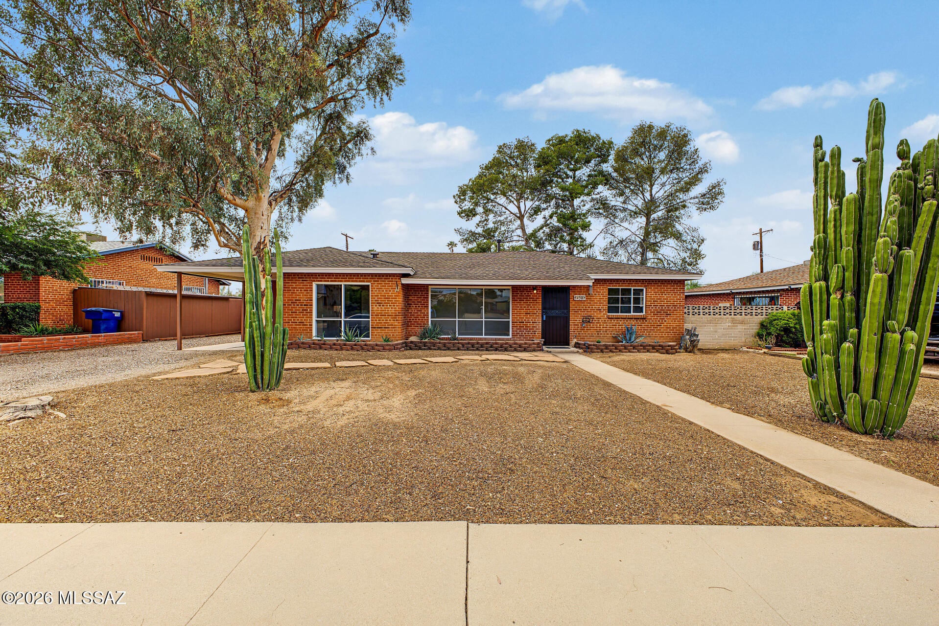 Conveniently Located and Beautifully Updated! This inviting 3-bedroom, 2-bathroom home is ideally situated near Park Place Mall, Palo Verde Park, medical facilities, and within walking distance of an elementary school. Mature trees provide shade and charm, while the sparkling pool offers the perfect place to relax and enjoy the Arizona sunshine. Inside, discover stylish wood-look luxury plank flooring, plush bedroom carpeting, rich brown cabinetry, new countertops, stainless steel appliances, and modern lighting and plumbing fixtures. Updated bathrooms feature trendy tile shower surrounds, complemented by fresh interior paint throughout. A double gate with alley access adds convenience and versatility. A fantastic find with comfort, style, and a great location--don't miss this one!