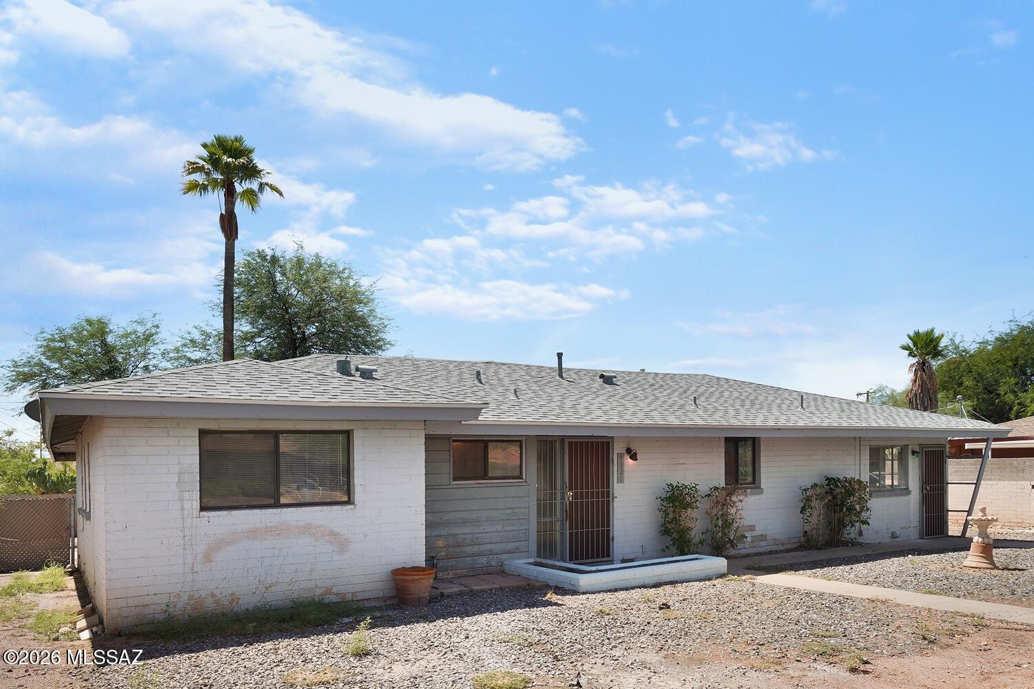 LABOR DAY SPECIAL  ONLY $1695  Beautifully remodeled through out with bright, spacious open feeling! Come see this 3Bdrm/2 Bath and large Arizona room. Gorgeous Kitchen with maple cabinets, granite countertops, appliances include gas range, microwave and dishwasher. Living Room exits to Arizona room with high beamed ceilings. Laundry/Office has its own side entrance. Ceiling fans, tile flooring throughout, extra storage, washer/dryer hook up. Private, fenced back yard with large cement patio, low care landscape with mature trees in front and back. Great central location!