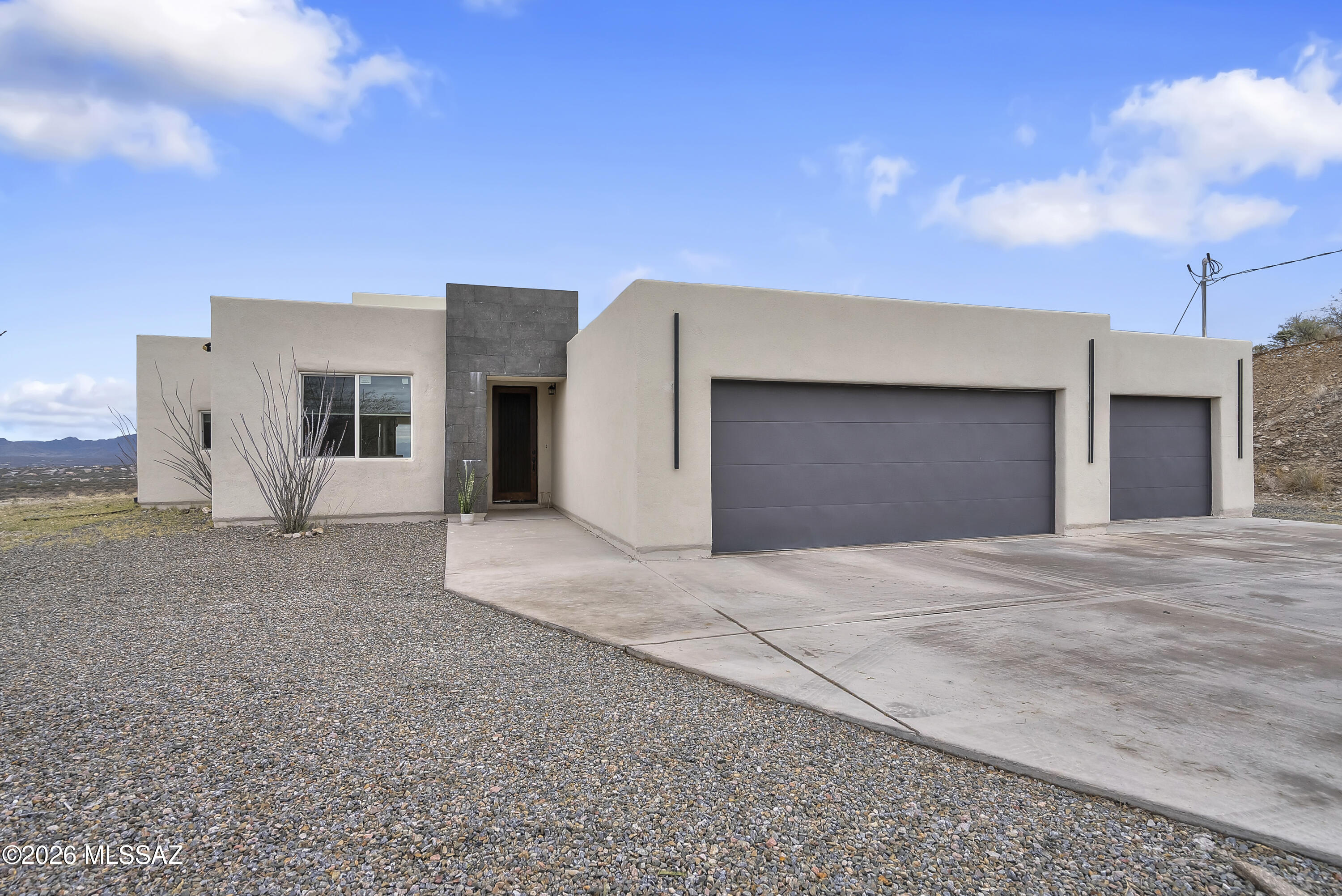 Panoramic Mountain Views! Enjoy the serenity of being surrounded by Arizona sky and desert landscape in this unique custom home. Open-concept floor plan features 4 bedrooms 3 bathrooms, two tone kitchen cabinetry, granite countertops, custom light fixtures, custom vanities and much more. The Master bedroom features an ensuite with a free standing bathtub and a large walk in shower. Room for RV parking and plenty of outdoor space for entertaining or just enjoying the most beautiful sunsets Arizona has to offer. Call for a private showing today!