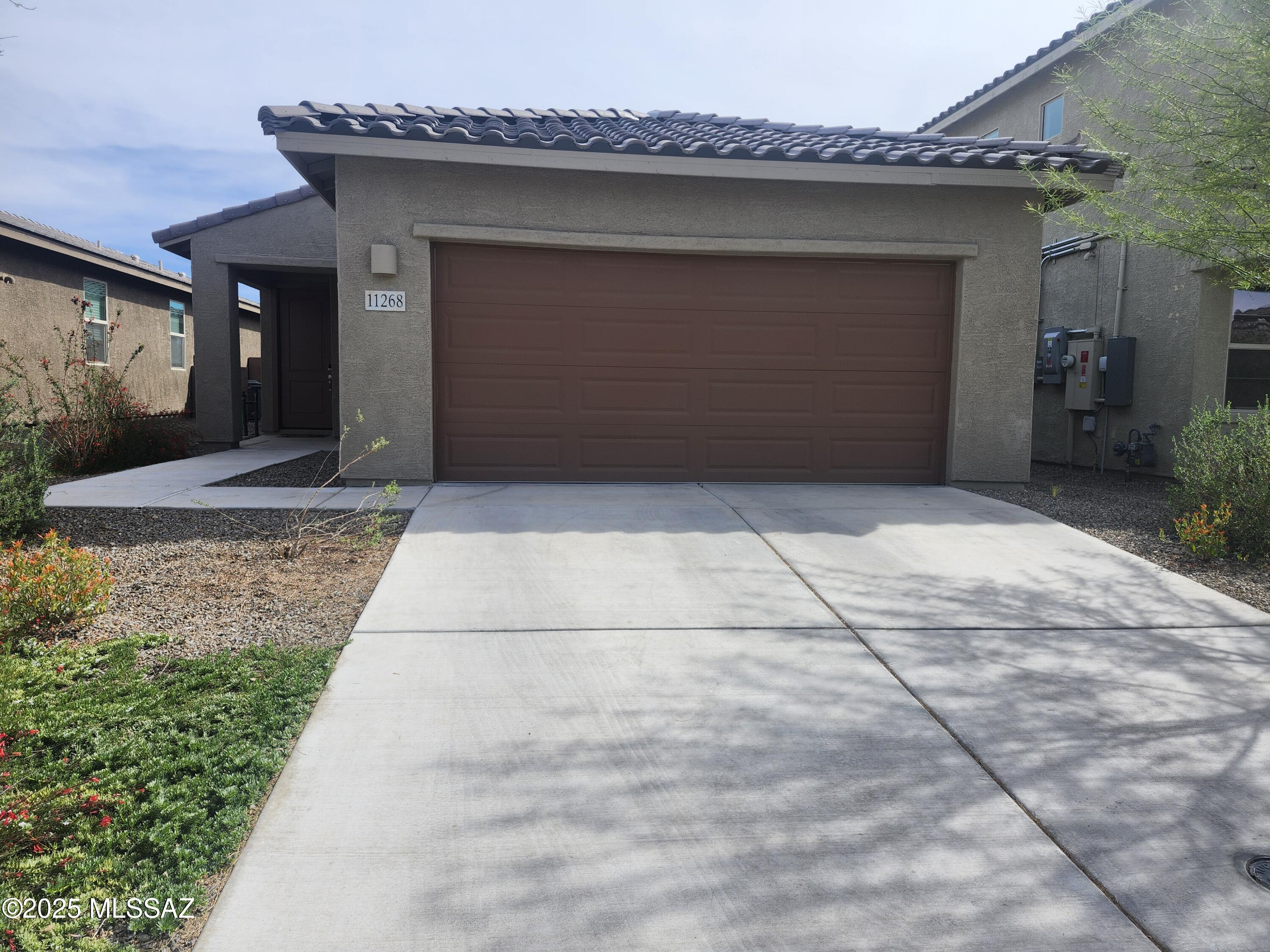 Welcome to your new home in desirable Hansen Ridge! This stunning 3-bedroom, 2-bathroom (with den) residence, built in 2022, features a spacious great room design with upgrades throughout. The expansive kitchen includes a center island with a breakfast bar, upgraded appliances, and a generous pantry. The large dining area opens to a covered patio, ideal for entertaining. The grand primary suite boasts a walk-in closet and a bathroom with large shower. Additional features include, split bedroom layout, ceiling fans, and a neutral color palette. The low-maintenance backyard, 2-car garage make this home a perfect choice. Located in the Vail School District, close to I/10, DMAFB and Raytheon.