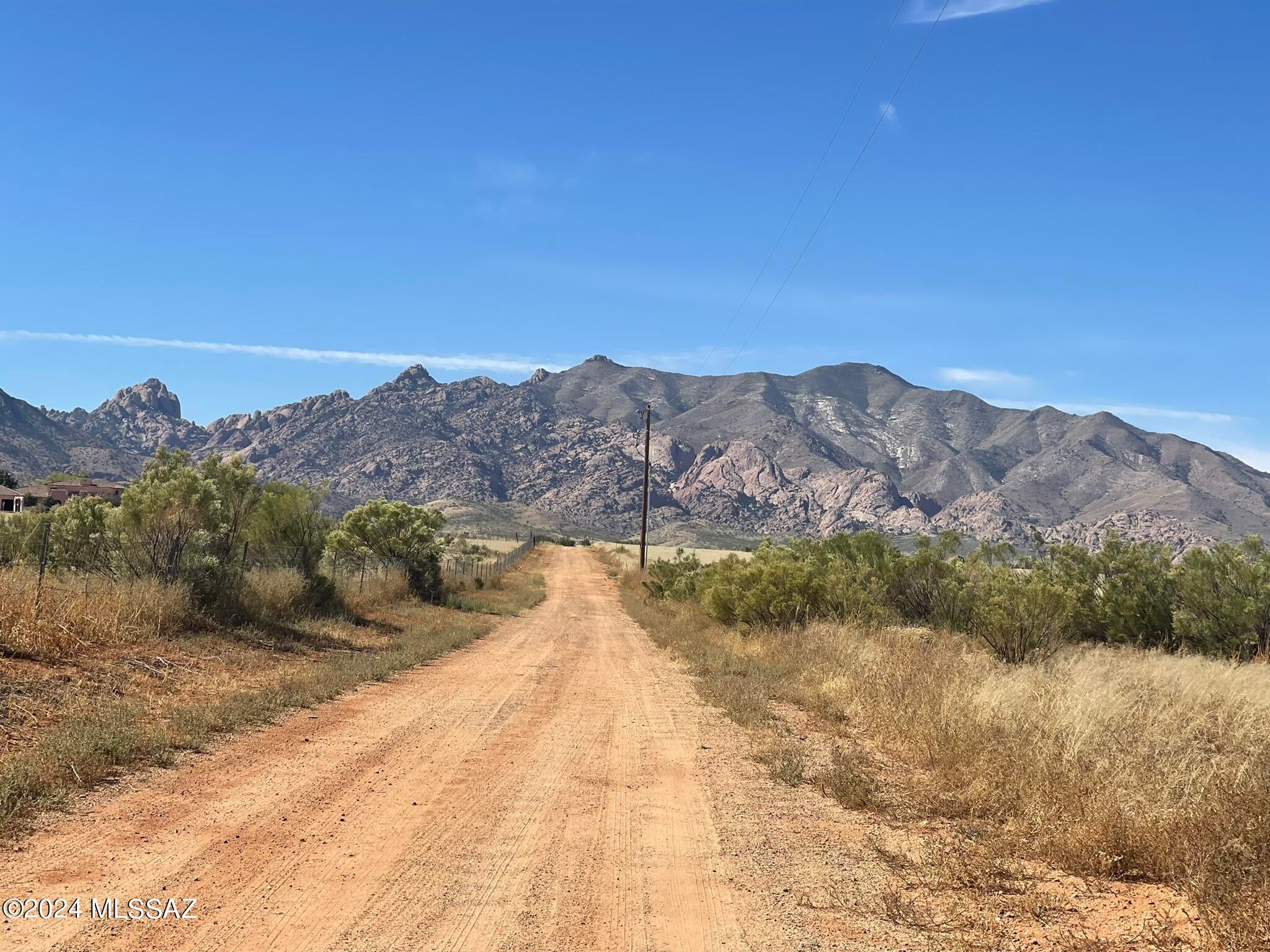 Escape to peaceful Pearce, AZ with this 0.83-acre desert parcel offering panoramic views and quiet surroundings. The land is flat and buildable with electric close by and options for septic, propane, and well/haul water. Located just off Windsong Rd, this lot is easy to reach yet tucked away enough to enjoy privacy and wide-open desert living. A great opportunity for anyone wanting space, views, and affordability.