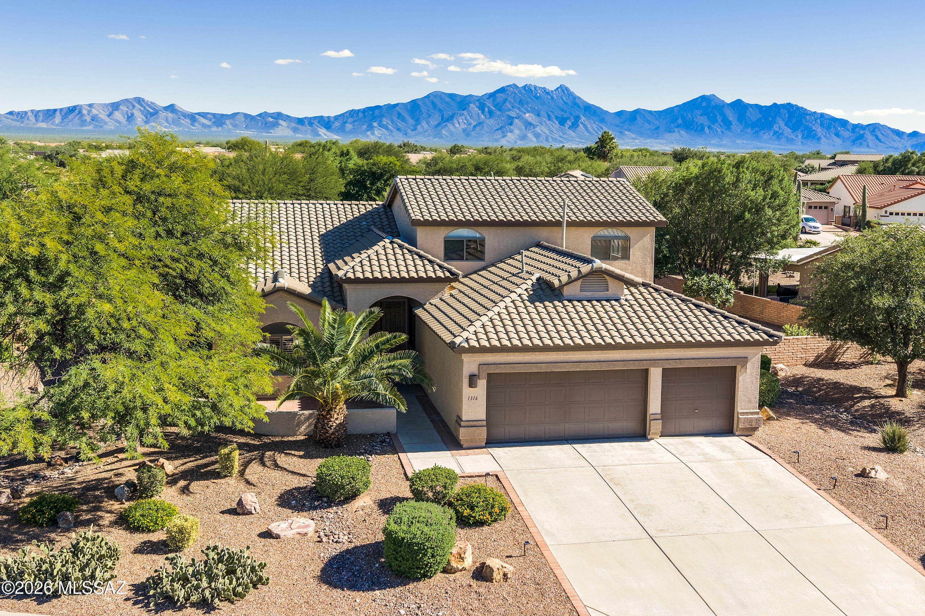 Experience exceptional space, privacy and versatility in this impressive Durango model, ideally situated on an oversized .36-acre corner homesite in Quail Creek. Offering 3,176 sq. ft., 4 BR, 2.5 BA and a full 3-car garage, this 2-story home features expansive living areas, a main-level owner's suite and beautiful outdoor spaces surrounded by lush landscaping. A welcoming front courtyard leads to a double-door entry and spacious foyer. Open living and dining areas off the foyer feature plantation shutters and provide flexible space for entertaining. An open-concept kitchen includes granite counters, breakfast bar, gas cooktop, wall oven and microwave and a generous casual dining nook. An adjoining family room creates a comfortable gathering space with easy access to outdoor living areas. Travertine tile flooring highlights the foyer, kitchen and family room. The oversized main-level owner's suite is filled with natural light and features a bay window. The spacious bath offers dual vanities, a soaking tub, separate tiled shower, travertine flooring and a large walk-in closet. A second bedroom on the main level can also serve as a den, office or hobby room. A powder room, multiple storage closets and a large laundry room complete the first floor. Upstairs, two additional guest bedrooms and a full bath provide privacy and comfortable accommodations for family and visitors.
 
Outdoor living is equally inviting, with an end-to-end covered rear patio, extended pavers and mature landscaping with citrus trees. The private homesite provides abundant room to relax, entertain and enjoy Southern Arizona's outdoor lifestyle. Additional highlights include new carpet throughout, a new roof in 2019, HVAC systems replaced in 2016 and 2025, and solar panels with a low-cost monthly lease. This distinctive home combines generous interior space, flexible living arrangements and exceptional privacy in the heart of Quail Creek.