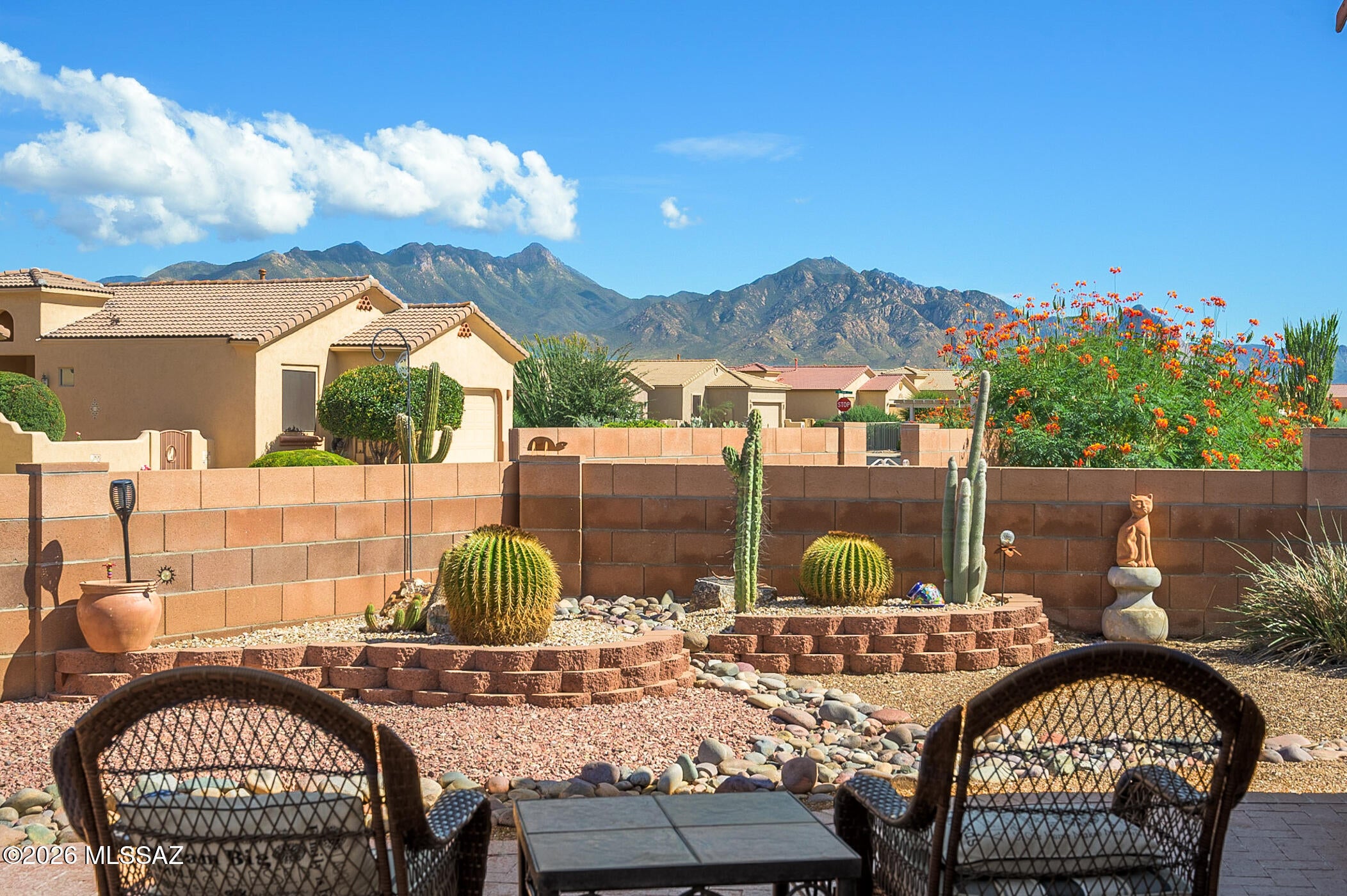 Imagine settling into this beautifully maintained,  in The Legends, where move-in-ready convenience meets inviting Southwestern style. This adorable home features tile flooring throughout and warm, desert-inspired paint tones that enhance its distinctive Southwest flair.  The well-appointed kitchen features granite countertops, a classic subway tile backsplash, stainless steel appliances including a gas range, and an attractive Southwest tile countertop at the arched opening to the great room.  Enjoy the spacious primary suite, with a customized walk-in closet and an ensuite bath featuring dual sinks and an easy-care shower.  The guest bedroom has direct access to the main bath, adding privacy for your guests.  Your outdoor living space is delightful with a variety of desert cacti for easy maintenance.  The covered patio is spacious and offers mountain views, or you can grab a little extra sunshine on the extended paver patio while you soak in the views! And to top it all off, it can be purchased completely furnished by Separate Bill of Sale, so all you have to do is head this way and move right in!