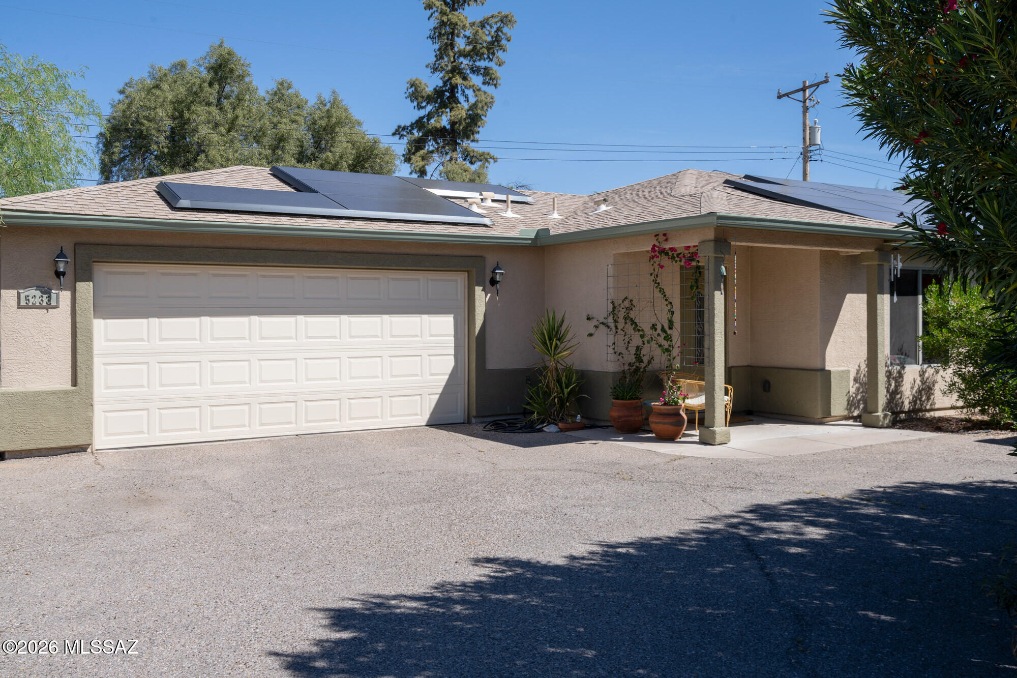 Private 3 bedroom, 2 bath home tucked away in a central Tucson location. Lofty ceilings in the great room and living room create a bright, open feel, while ceramic tile throughout and cork flooring in the bedrooms add comfort and function. The open living, dining, and kitchen layout works well for both everyday living and entertaining. The kitchen features generous cabinet storage, a pantry closet, granite countertops, and direct access to the yard. Bedrooms are nicely sized and well positioned off the main living area.

Outside, the property is private and low maintenance. Owned solar panels provide added efficiency and value, and the chicken coop offers flexibility for gardening or a backyard homestead setup. The garage includes ample storage. Conveniently located near shopping, school Park Place, and everyday amenities, this home is well kept and move in ready.