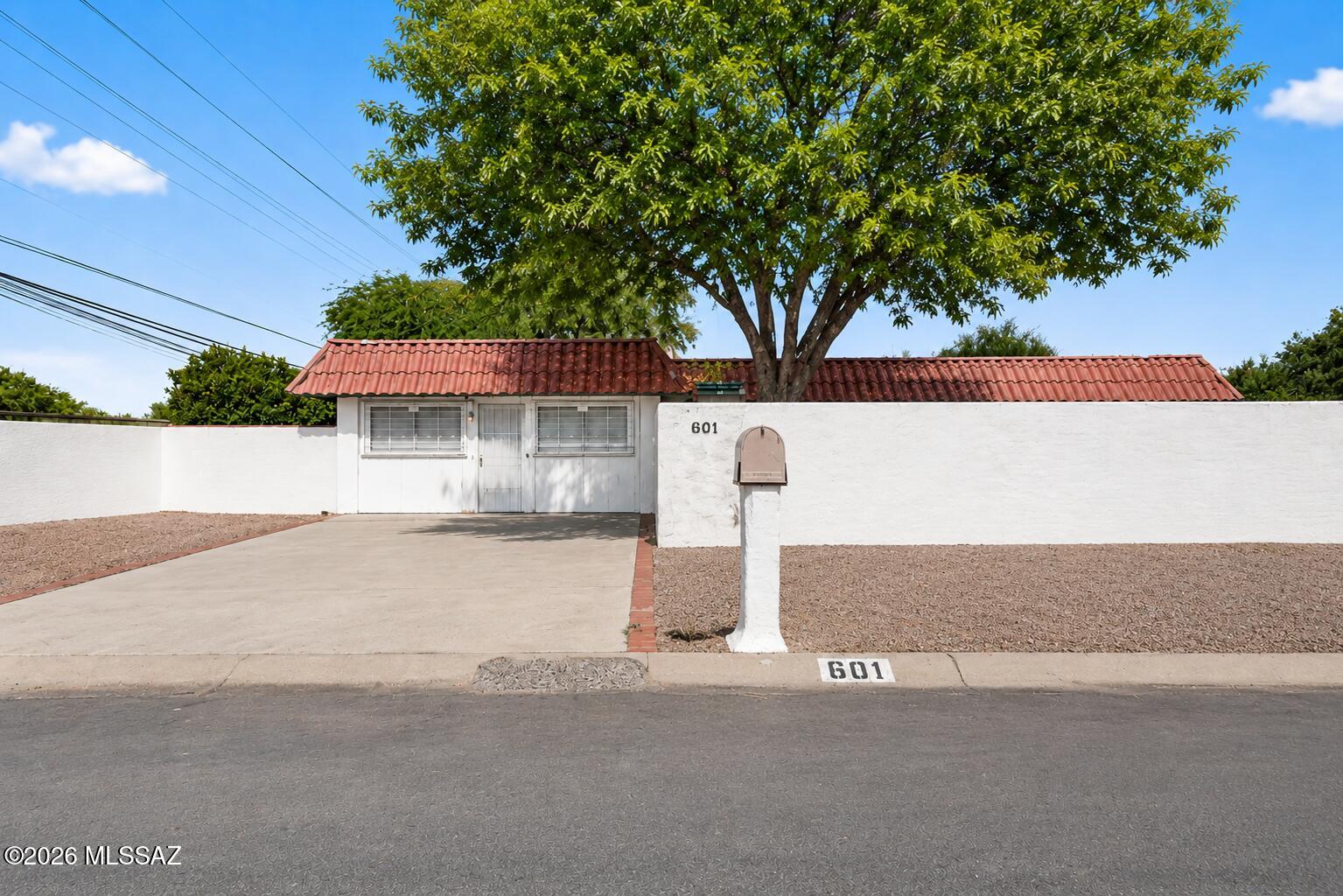 Discover over 2,000 sq. ft. of versatile living space in this 3-bedroom, 2-bath home! Designed for flexibility, it features a spacious living room, separate family/bonus room, and an Arizona room--perfect for entertaining, a home office, or hobbies. The kitchen offers abundant cabinetry and generous counter space. The primary bedroom is nicely sized with a distinctive curved glass-block shower and dual vanities that add character. Situated behind a private walled courtyard with low-maintenance landscaping and ample parking, this home is conveniently located near shopping, dining, schools, parks, and major commuter routes. A unique opportunity with endless possibilities!