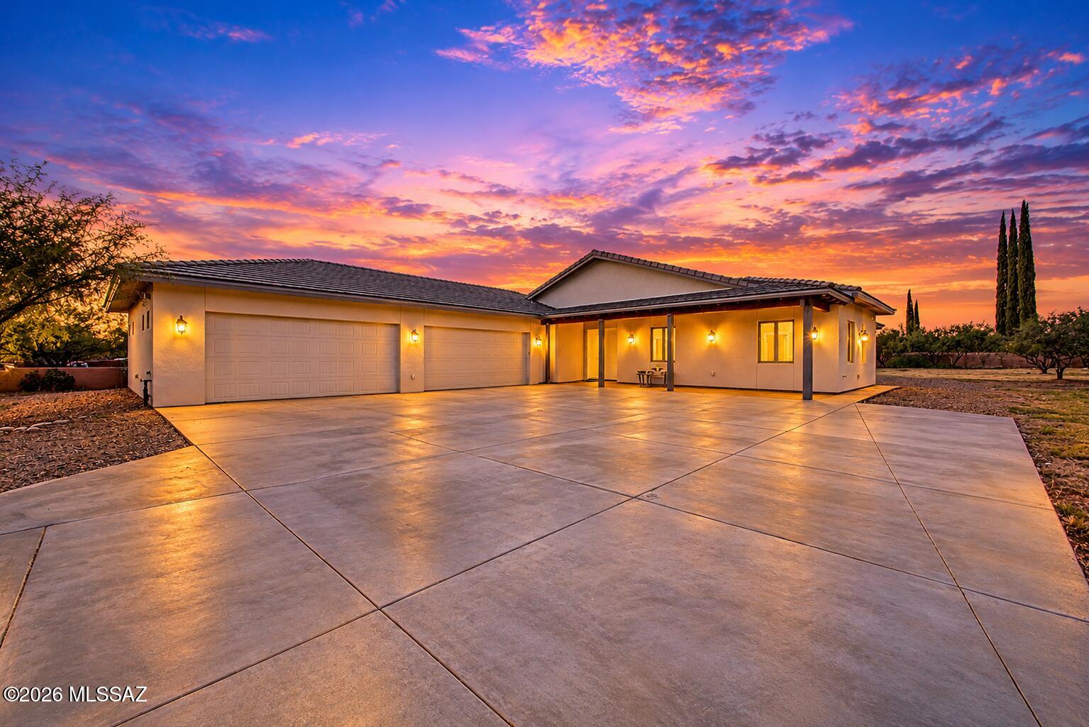 Experience modern desert living in this beautifully appointed 2021 high-tech home, where mountain views, luxurious spa-inspired comforts, and thoughtful upgrades come together on a flat, horse- and RV-friendly acre with NO HOA. 
Exceptional efficiency is a standout benefit, with seller-reported electric bills averaging approximately $80 per month and water costs approximately $400 per year. Foam insulation in the walls and ceilings and ENERGY STAR appliances bring comfort and economical everyday living to this inviting desert retreat. The highly sought-after open, split-bedroom floor plan offers an elegant flow for entertaining while positioning bedrooms in three separate areas for privacy. Beautiful tile flooring extends throughout, and a heat-producing fireplace insert creates a warm, welcoming focal point in the great room. High-tech adjustable lighting transitions from bright illumination to a soft ambient glow, allowing you to create the perfect atmosphere for a lively gathering or a relaxing evening at home.

The beautifully appointed gourmet chef's kitchen centers around an impressive 6' x 8' island, providing abundant space for preparing meals, casual dining, and conversation. Sleek stainless steel ENERGY STAR appliances complement an induction stove with responsive temperature control and an easy-to-clean cooking surface. The seamless connection to the great room and formal dining area makes entertaining effortless and keeps everyone comfortably connected.

Retreat to the luxurious primary suite, where a second heat-producing fireplace insert and direct patio access create a peaceful setting to begin and end your day. The spa-inspired bathroom invites relaxation with a soaking tub, walk-in steam shower with a built-in seat, touch-control mirrors, and a double vanity with convenient corner storage. A beautifully organized walk-in closet fitted by California Closets completes the suite. Two additional bedrooms offer welcoming accommodations for family and guests or flexible space for a private home office.

A thoughtfully designed laundry room connects to the expansive four-stall garage, where generous space offers the versatility to create a dedicated workshop or personal fitness area alongside vehicle parking. A separate storage room with exterior access keeps outdoor essentials neatly tucked away. Adding to the home's thoughtful amenities, connections are already prepared for a water softener and water filtration system, with gas hookups available for the laundry and oven.

Outside, beautiful mountain views provide the backdrop for an acre filled with possibilities. The spacious, unlandscaped grounds offer a blank canvas for a sparkling pool, gardens, horse amenities, or your own outdoor entertaining retreat. A prepared hot tub platform is already in place, while RV hookups on three sides of the house provide exceptional convenience and flexibility. Front and rear water spigots, electrical outlets on all sides, and exterior gas plumbing reflect the thoughtful planning throughout this distinctive property--a beautiful blend of modern technology, luxurious comfort, and room to make your vision a reality.