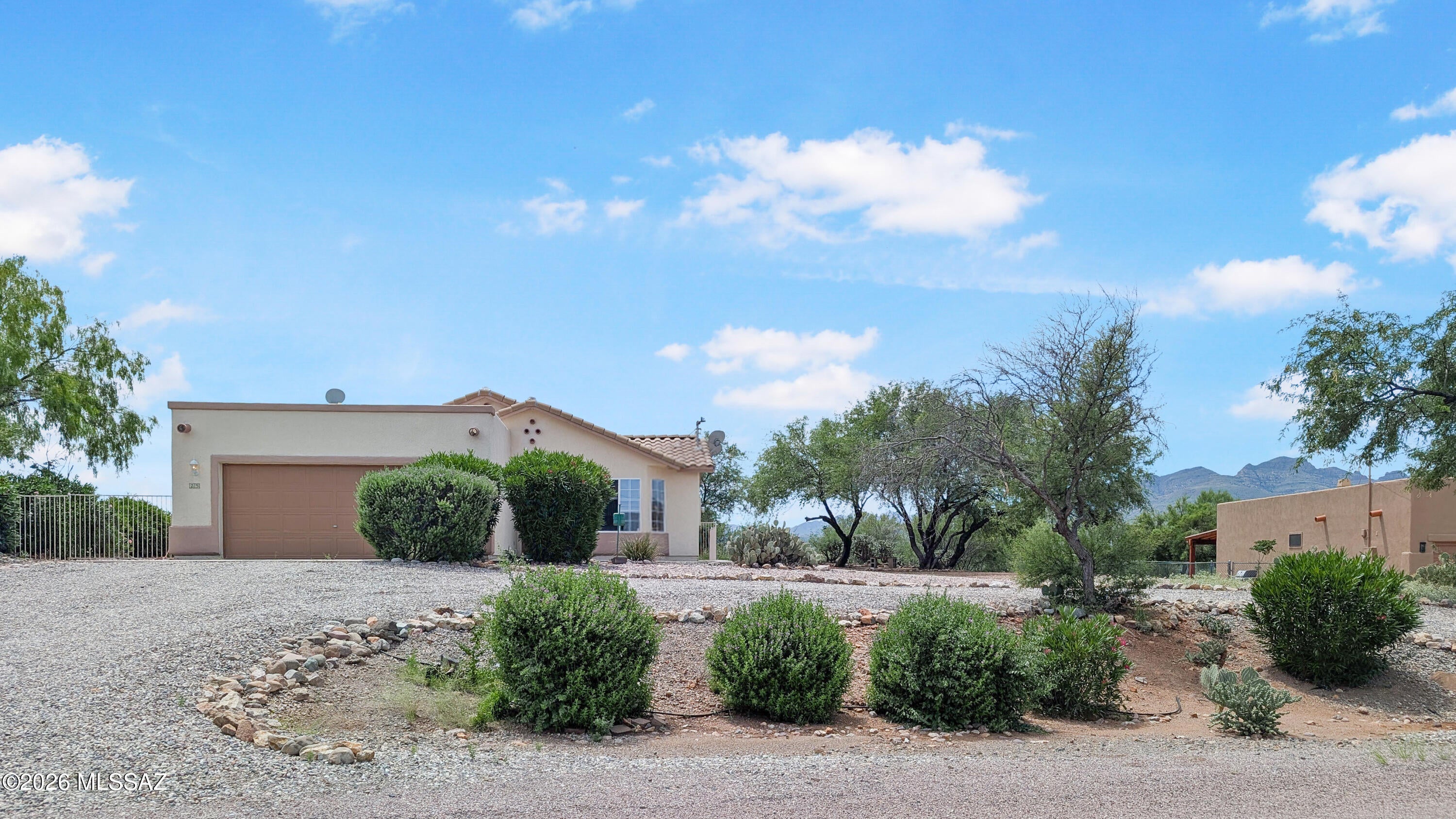 Spread out with .6 ac !Covered Patio & 5 ft steel fence. Newly carpeted three bedroom home with 2 car attached in peaceful  where birds and wildlife roam.  The eat-in kitchen features a pop-out window, dishwasher, disposal, electric range & refrigerator.  The counter space has a pass through counter to the living room.  or bar stool area.  The primary bedroom has an attaching bathroom with double sinks, garden tub, and walk-in closet.  This bedroom has a private exit to the covered  patio.  This split floor plan has two other bedrooms, full bathroom, kitchen, & separate laundry room.  There is an exit from the laundry room to garage. Front covered porch & sidewalk to rear patio. Greats floor plan & new kitchen flooring.