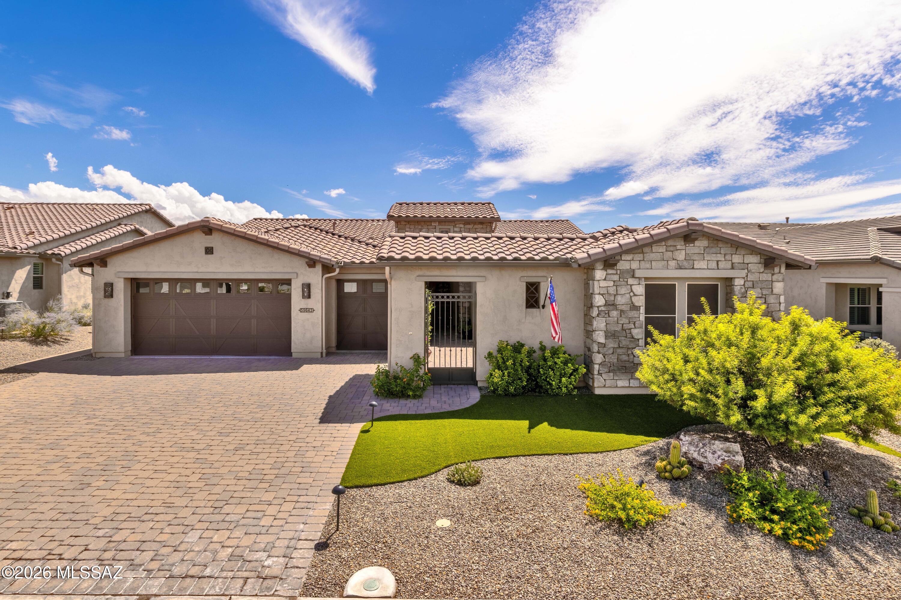This is by far the highest and most upgraded home in all of SaddleBrooke Ranch.  The owner has taken what was a Tesoro model with an attached Casita and turned the interior of this home into a home fit for the ''royal family''.  All the Cabinets, Doors, Door Frames, Flooring, Base Boards, Lighting Fixtures, Wall Units, Showers, Bathtubs, Sinks, Faucets, Door Handles, and Rooms and Bathrooms were literally re-configured or expanded through the original build to come up with this ''Custom Home''.  Physically this incredible home has 2-Bedroom En- Suites; a Powder Room; a Great Room; a Dining Area; a Grand Kitchen Island that was completely re-built; a Walk-In Pantry; a Butler's Alcove; a Great Room w/Media Alcove; a Spacious Den w/Built-In Bookshelves; a Master Suite has been completely reconfigured with a Custom Tub and Walk-In Shower, New Cabinetry, lighting, etc. + a large Walk-In Closet; an Owner's Entry Valet w/Storage; a Walk-Up Dry Bar; a Large Laundry Room; a Deep 2-Car Garage w/Golf Cart Garage w/Epoxy Coating, w/Central House Vacuum, Water Filtration System, Side Access Door, and Enclosed Storage Area + Extra Storage; a 220 Sq. Ft. of Covered Patio Space w/Optional Outdoor Living Space making the Covered Patio just over 440 Sq. Ft.; 9' & 10" Ceiling Heights, and to top it all off an Attached Casita with Portico that creates this beautiful front courtyard that you walk through to get to the front door!  This home majestically sits right behind the behind 15th-Hole green looking directly at the pin flag and Mount Lemmon is looming in the backyard - what a view!