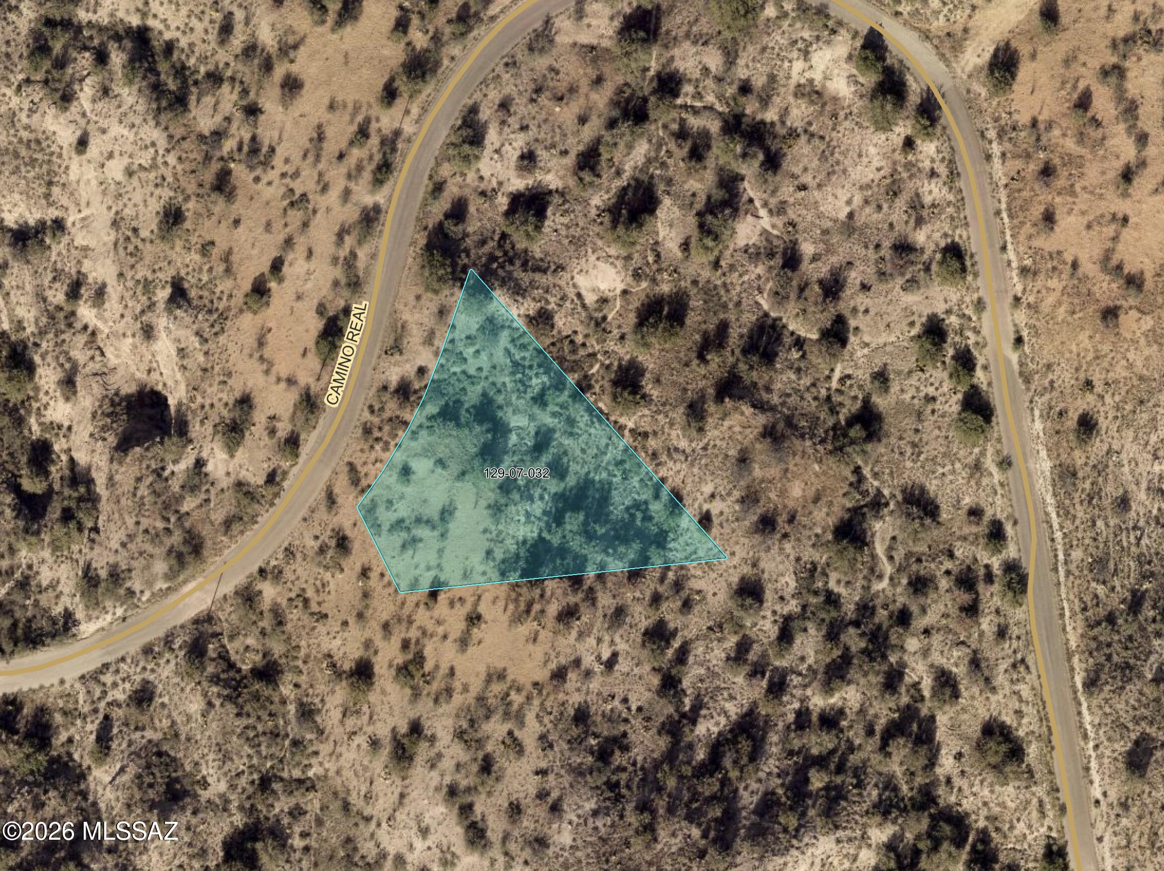 Build-ready 0.84-acre homesite in Rio Rico with panoramic mountain views fronting paved, county-maintained Camino Real on a quiet hillside loop. Zoned R2 for a single-family home and NOT on the county's unbuildable list, with east-side mountain and valley views and no HOA. Surrounded by existing custom homes. Buyer to provide well and septic -- no water/sewer to this pocket; verify utilities and percolation. ~12 mi to Nogales, ~60 mi to Tucson off I-19.