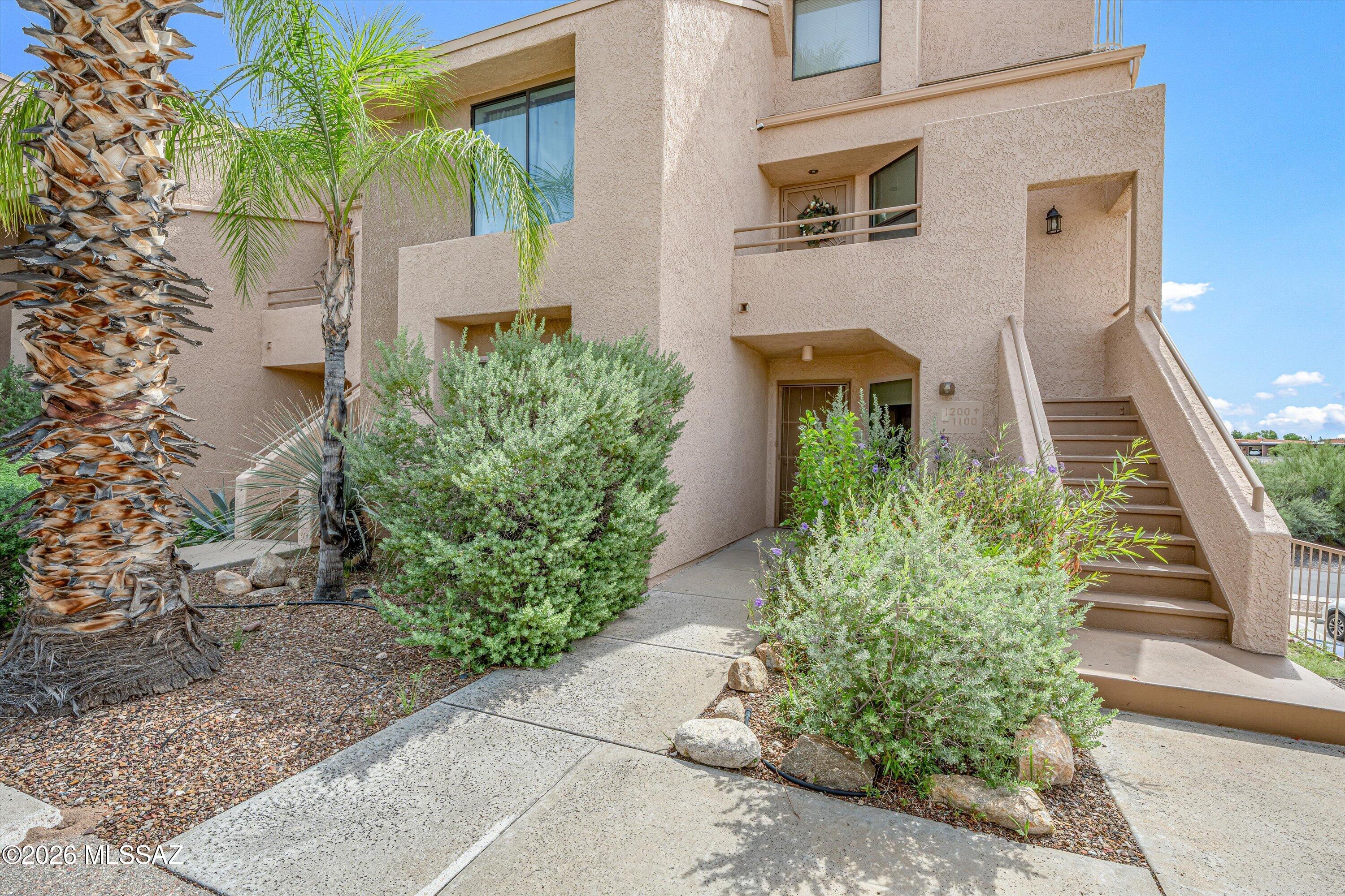 Nestled in the heart of the Catalina Foothills, this meticulously updated gated condo pairs modern comfort with effortless desert living. Expansive ceilings and a cozy wood-burning fireplace anchor the freshly painted great room, while a custom-added wet bar nook makes entertaining seamless. 
Home Upgrades & Interior Highlights
Kitchen & Dining: Refinished cabinetry, stone countertops, an oversized prep island, newer stainless-steel appliances, an integrated Culligan water purifier, and the newly added wet bar nook.
Baths & Living: Freshly painted great room, newly painted primary bath cabinetry, 2 spacious bedrooms, and 2 full bathrooms.
Outdoor Oasis: A private, freshly painted and sealed balcony-accessible from both the living room and primary suite-fully equipped with a new mister.