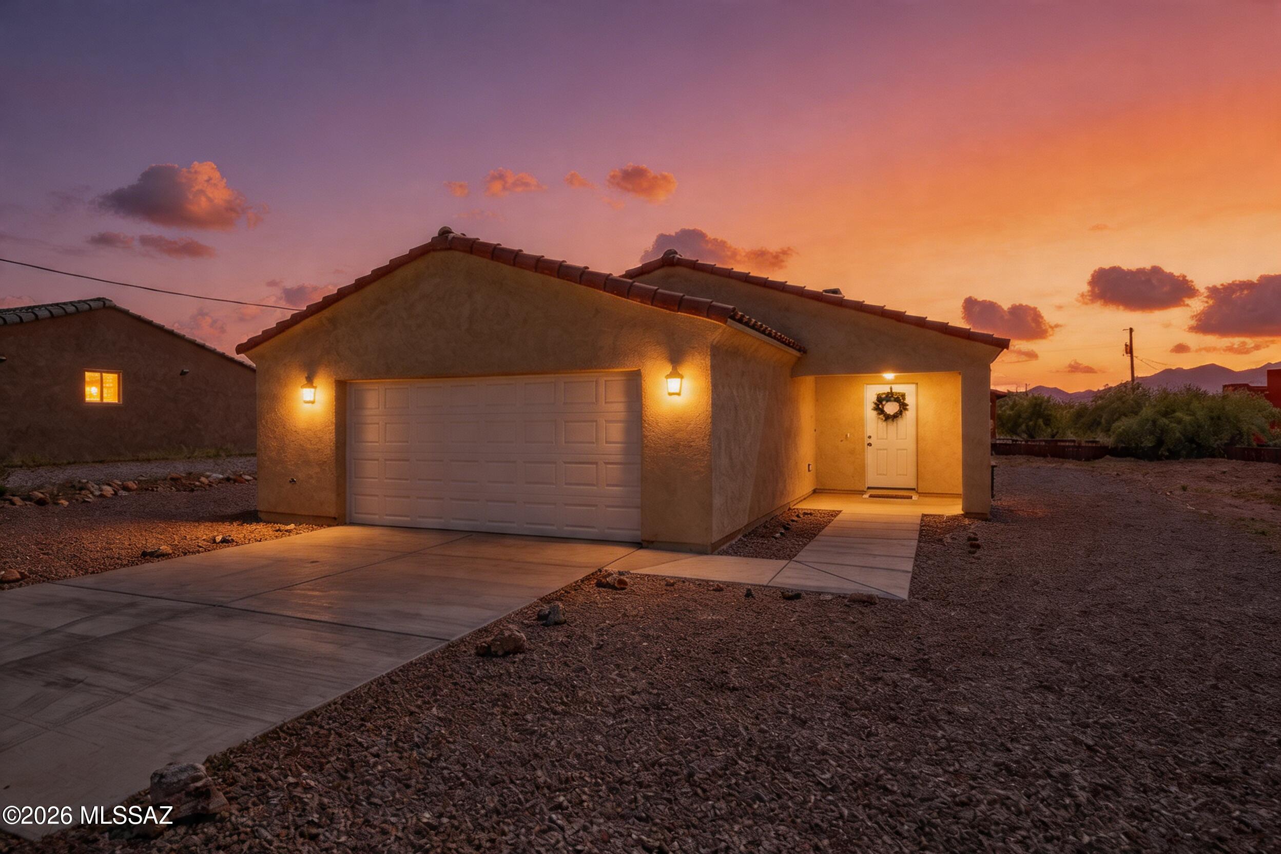Welcome to this charming single-story home tucked away on a quiet cul-de-sac in Rio Rico. Offering 3 bedrooms, 2 bathrooms, and 1,427 square feet, this home features a functional layout with wood look tile flooring throughout for a seamless, low maintenance living space.
The kitchen is equipped with light oak cabinetry, granite countertops, and stainless steel appliances, opening to the main living areas for easy everyday living. All bedrooms are generously sized, and both bathrooms carry through the same cohesive finishes with granite countertops and oak cabinets. The guest bathroom includes a tub/shower combination with a tile surround, while the primary suite features a custom tile shower. Enjoy outdoor living under the covered back patio, along with a nicely landscaped front yard and a 2-car garage. Located on a peaceful street, this home offers comfort, simplicity, and move in ready appeal.