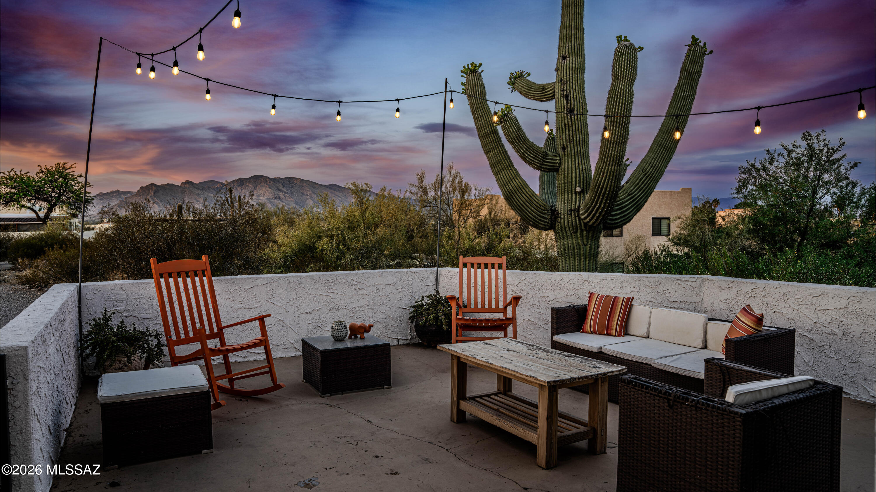 Set in the desirable Del Cerro Estates on Tucson's west-side foothills, this exceptional property offers over an acre on one of the subdivision's most premium elevated lots. Enjoy sweeping mountain and sunset views from nearly every angle, with a private drive that enhances the home's secluded, tranquil setting. A charming courtyard entry welcomes you with a peaceful sitting area--perfect for relaxing evenings and taking in Arizona's stunning sunsets. Inside, the home impresses with soaring ceilings and an abundance of natural light. The spacious living and dining areas have been freshly painted and feature modern lighting, creating a bright, open, and inviting atmosphere with picturesque views from every window. The fully remodeled kitchen is designed for both function and style, ....... showcasing granite countertops, dual ovens, and a large center island--ideal for any home chef. It seamlessly flows into the family room, where a striking central fireplace provides the perfect setting for cozy nights and effortless entertaining. The downstairs layout is open, airy, and thoughtfully designed for everyday living. Upstairs, you'll find four generously sized bedrooms, including a luxurious owner's suite with breathtaking city light views. The en-suite bathroom has been completely remodeled and features a soaking tub, dual vanities, and a sleek, modern walk-in shower. The additional bedrooms are spacious and share an updated bathroom with dual sinks and contemporary finishes. Throughout the home, you'll find fresh interior paint and updated flooring with no carpet, offering a clean, modern feel. Major renovations completed in Winter 2021 through Spring 2022 include new flooring, complete plumbing updates, garage flooring, water softener, reverse osmosis water filtration system, HVAC system, and septic leach field--providing peace of mind and modern efficiency. The expansive backyard is a true nature lover's retreat, offering endless possibilities for outdoor living, sunset entertaining, and relaxation, with ample space to add a pool. With no HOA and plenty of room for RV parking or recreational vehicles, this property combines privacy, luxury, and flexibility in one remarkable setting.