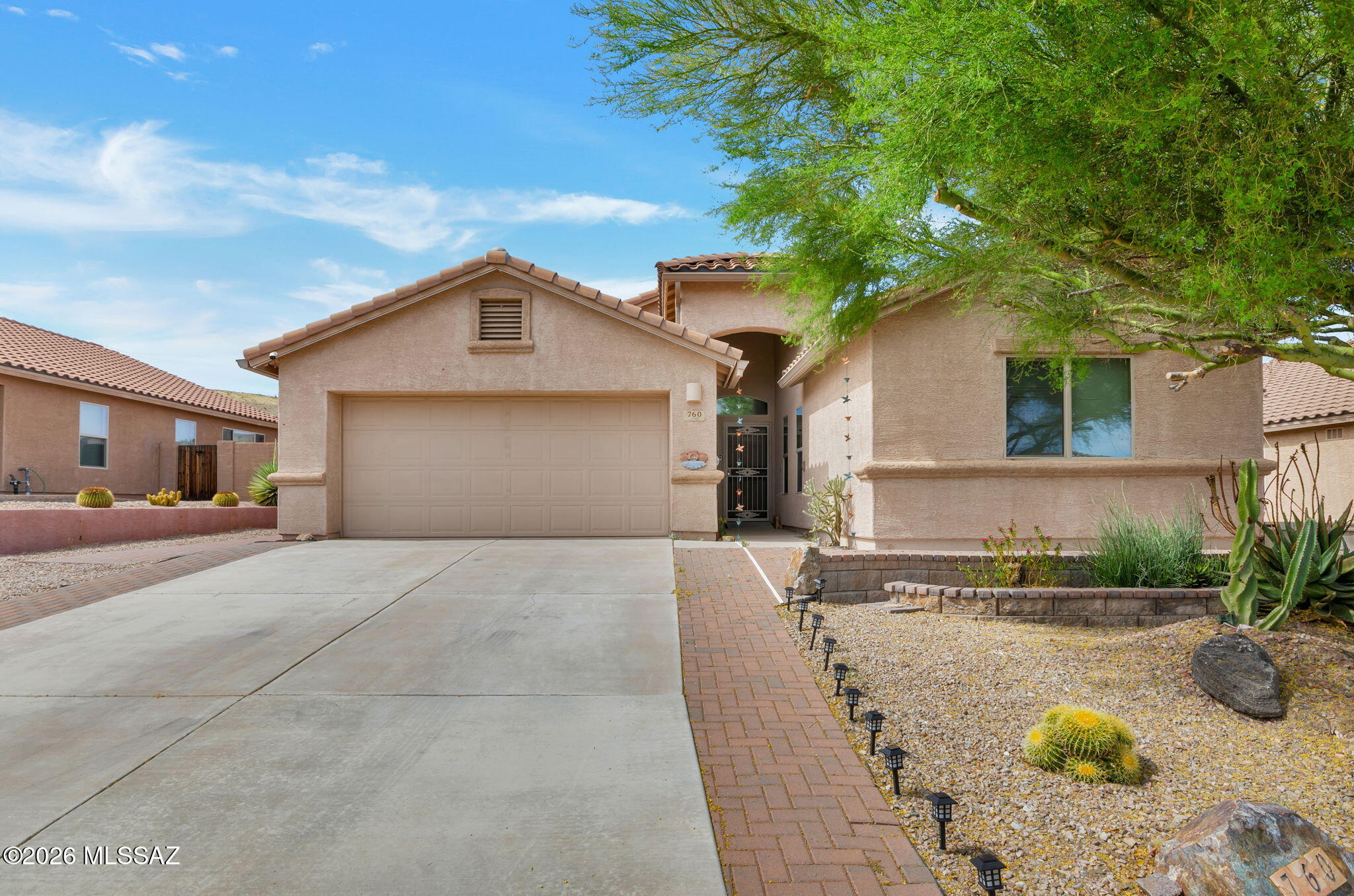 Entertainer's energy-efficient dream! Light-filled, flowing floor plan opens to landscaped yard ideal for gatherings. Patio paradise features built-in BBQ grill, smoker, turkey cooker, pizza oven & bar. Soak in the spa, or cozy by firetable in huge AZ Room w/beautiful view. Kitchen boasts lighted, custom island top, abundant cabinets, roll drawers, pantry & gas stove. Lrg Owner's Suite has bay w/bench; bath has shower+seat, walkin, dual sinks & toilet w/bidet. Roomy Den & Guest Room for function & comfort. Energy & tech features abound! OWNED solar; rainwater system; 200 AMP in garage for EV; whole-house air filter; R/O, surge protect, electricity monitor++! Enjoy hobbies, exercise & new friends in GV Rec membership lifestyle. RV Gate, shed, planting beds & gabion fountain. SEE SUPPLMNT HOME SYSTEMS:
" Solar System - OWNED
" Pelican Smart Combo Water Purifier/Water Softener
Pelicanwater.com Models: PSE1800/PSE2000 & PSE1800-2000
REV U
" Emporia Electricity Monitor
" Rainwater Recovery System:
 - tanks about 5 feet by 3 feet , each holding tank holds
approximately 35 cu feet water
1 tank, overflow, is 5' x 2'
. Approximately 16 cubic feet
capacity.
Tanks are connected underground by A piping system. Can be
connected to the drip irrigation system. Overflow system
empties out to the front yard.
" Premier water filter model RO-PURE PLUS tank reverse osmosis
system
" Outdoor Chef's Center Built-in Kitchen components:
o Traeger pellet smoker/grill model BBQ400
o Blackstone patio oven model# 1575
o Solar oven inside BBQ island (far left side)
o Pizza oven
o Infrared turkey cooker
o Burner system next to bbq grill
o Drawer for utensils
o Custom, cement countertop with inlaid glass designs
" Whole-house surge protection system: Eaton 15 ampere/50 ampere
" Submersible sump pump (pond)
" Whole-house Air Filter
" Mini-Split in garage: MRCOOL DIY SERIES- GEN2 www.mrcool.com (AC only)
INTERIOR DESIGN FEATURES:
" Custom epoxy river-style island top with agate slices
" Both bathrooms have custom countertops epoxy
" Master bedroom has window seat with storage
" Most of kitchen cabinets have custom drawers and all were legthened
from builder quality
" Comfort height toilets
" Open side shelves on Kitchen Island
" Garage has Hanging storage rack from ceiling
" Workbench
" Metal, wire shelving
LANDSCAPE FEATURES:
" Raised flower beds on 2 sides of backyard
" Free standing sheds for tools & storage
" Landscape includes:
o 2 meyer lemon trees
o Variety of cactuses
" Custom made, gabion style waterfall with local rocks
" Stacked stone planter in front yard. Stone/paver patio in front of house
ARIZONA ROOM:
" Spa
" Firepit natural gas inside metal columns
" Multiple seating areas
Additional technical detail and specifications available on several
systems with accepted offer.