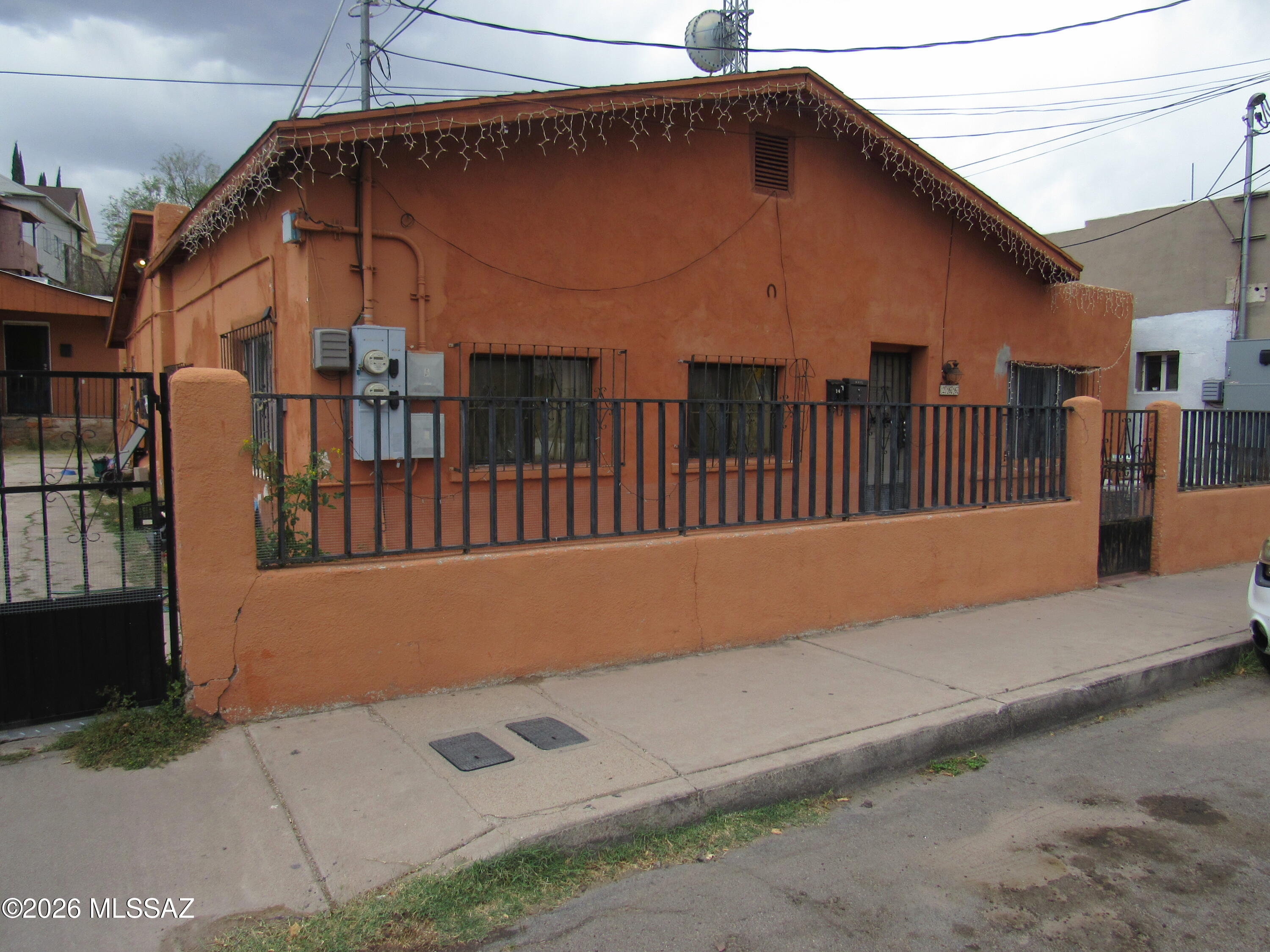 Downtown home features a single family residential house built in 1900 with 1400 sq. ft. living area with 3 bedrooms, 2 baths.  Back unit is a one bedroom, one bath apartment built in 1964 with 737 sq. ft. living area.  Parking in walled-in yard.