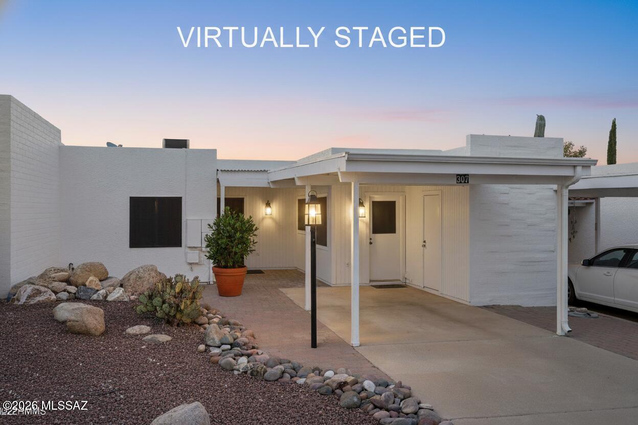 Welcome home to the perfect blend of comfort, style, and effortless desert living. This beautifully updated townhome offers everything you need to slow down, soak it all in, and truly enjoy the Arizona lifestyle.
Step inside to find a light-filled, open living space that feels both spacious and welcoming. The updated kitchen is a showstopper -- thoughtfully refreshed with modern finishes that make cooking and entertaining a pleasure. A comfortable guest room means there's always room for the people you love.
But the real magic? It happens outside.
Your private backyard is an entertainer's dream -- a seamless blend of covered and open-air living space designed for every season and every mood. Gather around the fire pit under a canopy of stars, unwind in the hot tub after a long day, or tend to your own garden in the warm Arizona sun. Whether it's a Sunday BBQ with friends or quiet morning coffee on the patio with the birds waking up around you, this outdoor space was made for living well.
The front entry is just as inviting -- beautifully landscaped and welcoming from the moment you arrive.
Beyond your own backyard, the lifestyle only gets better. Take a refreshing dip in the community pool, or stroll to the heart of town for the farmers market -- fresh produce, local vendors, and that small-town charm just steps from your door.
With minimal upkeep and maximum enjoyment, this townhome is the one you've been waiting for. Come see why Southern Arizona isn't just a place to live -- it's a way of life.