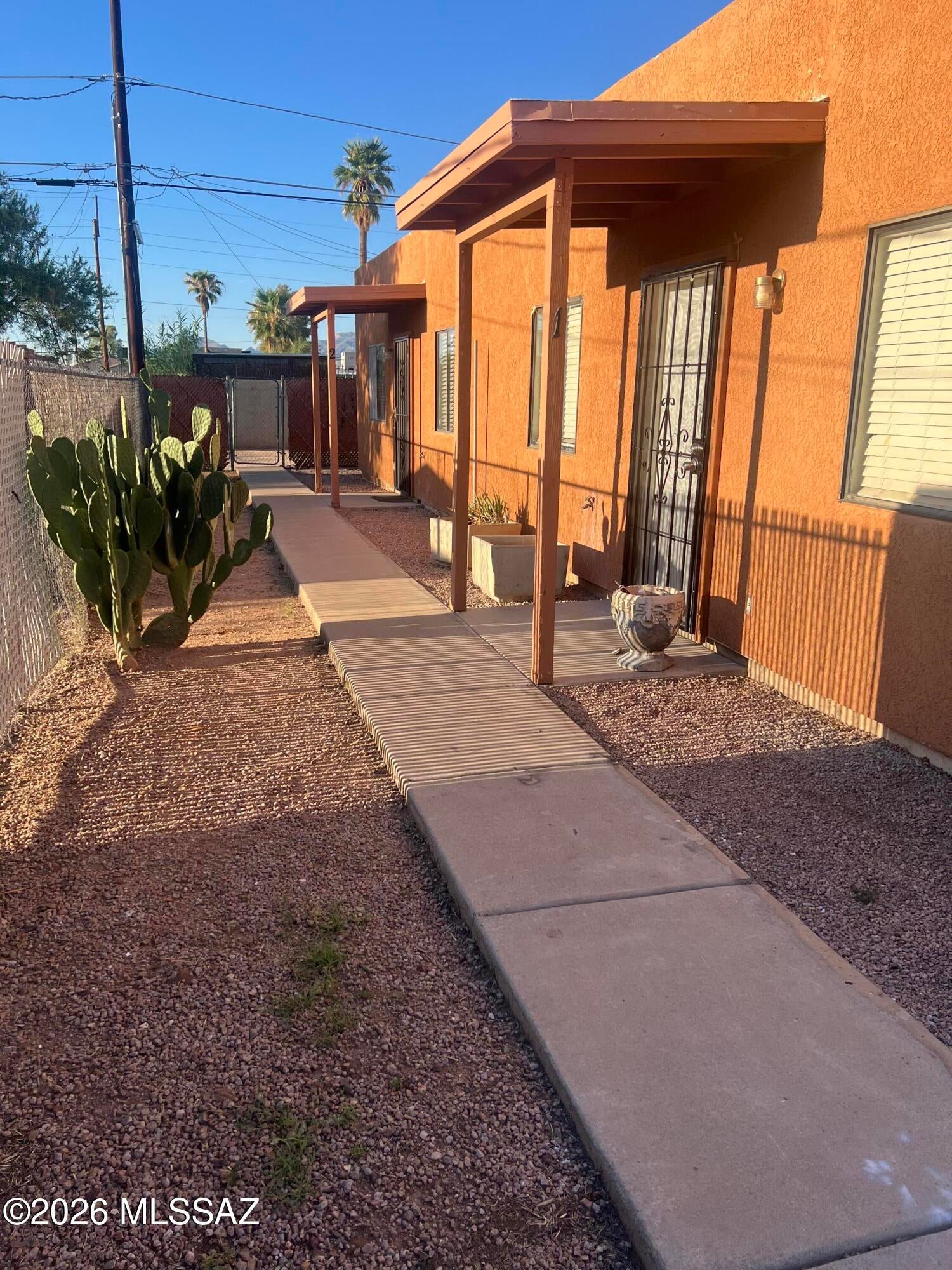 This duplex sits very close to Univ. of Arizona. Front unit has been updated. Back unit needs some TLC. Front unit features polished concrete floors, low flow toilet, fresh paint, tiled shower and cultured marble vanity. Large lot with ample parking. Possibility of another unit or small dwelling could be added. Check with City of Tucson.