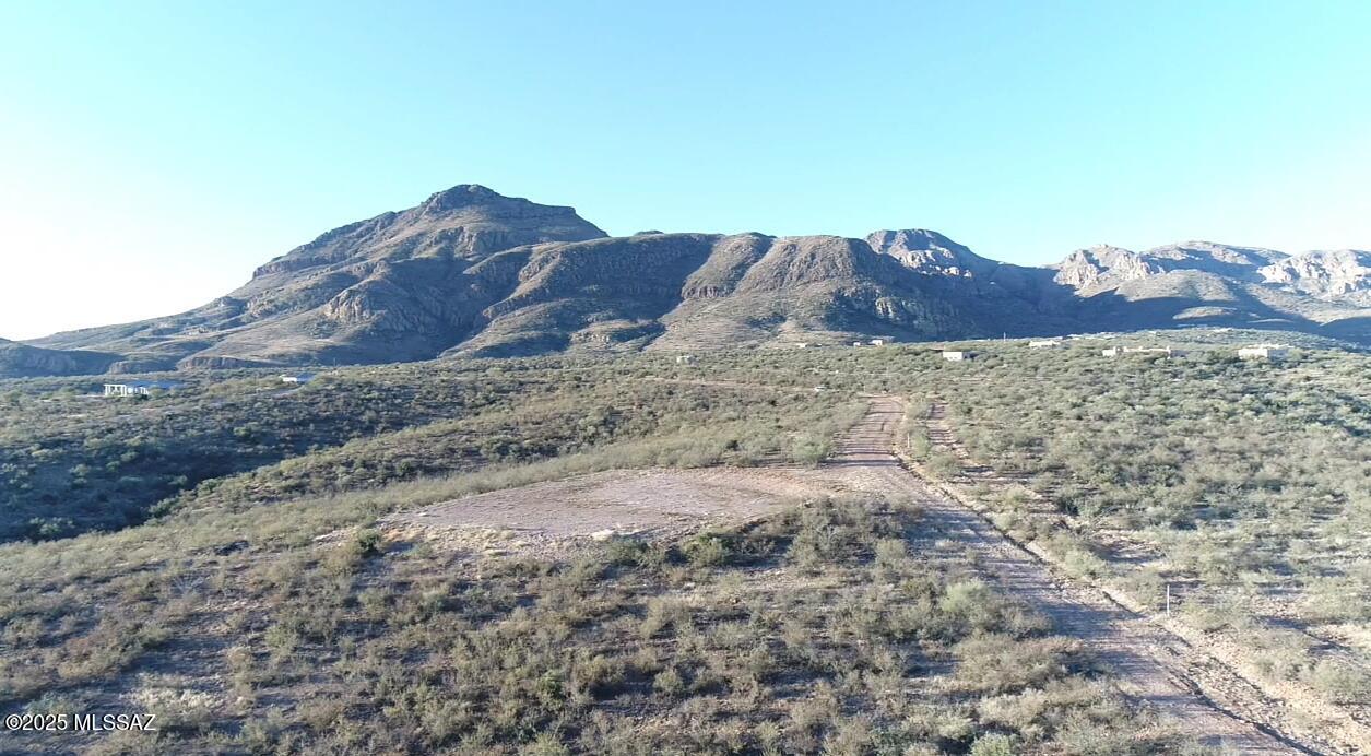 Parcel #4 is the place to build your Dream Home.  Perched high above the valley, this exceptional property showcases sweeping panoramic views of the Tumacacori, Santa Rita, and San Cayetano Mountains, with the distant Catalinas glistening on the horizon. Offering remarkable peace and privacy, this serene desert sanctuary feels worlds away while remaining just minutes from the historic village of Tubac, celebrated for its distinctive shops, art galleries and charming restaurants. A private well serves the property exclusively, electric is available at the property line, and a graded homesite pad is already in place, providing a seamless start to bringing your dream home to life. Adding to its appeal, the land may be subdivided into up to five parcels, each exceeding 4.13 acres, creating excellent investment or development potential.  Owner will consider financing with percentage down.  Surrounded by abundant wildlife, breathtaking stargazing, and the quiet beauty of nature day and night, this remarkable Tubac offering is ideal for a tranquil retreat, a family compound, or a thoughtful development opportunity you won't want to miss.