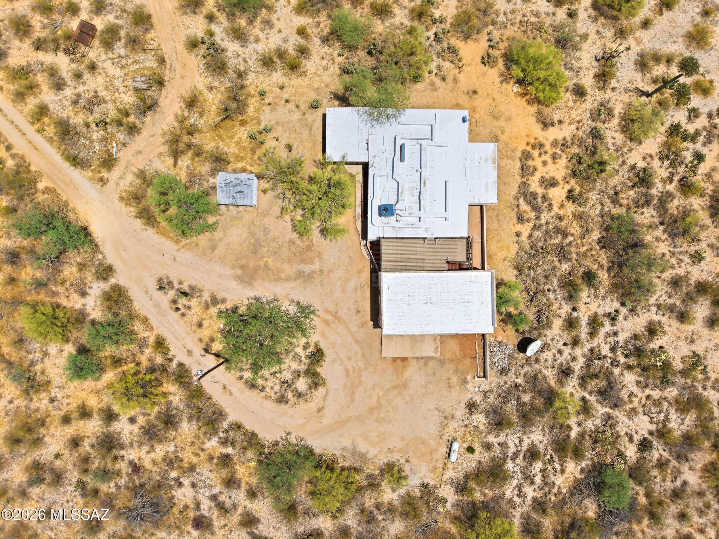 VIEWS -Almost 10 ACRES, NO HOA, Rare opportunity to own a FIXER UPPER home with breathtaking 360-degree views in every direction. Enjoy unforgettable sunrises and spectacular Arizona sunsets from the rooftop viewing deck, featuring historic stairs from the Old Pioneer Hotel that add unique character and charm. 

Incredible potential with splittable land, making it ideal for investors, builders, or anyone looking to create a private desert retreat/ranch. Located near Saguaro National Park, the setting is peaceful, scenic, and surrounded by natural beauty.

The home features a large shaded back patio perfect for relaxing outdoors, plus a huge carport and attached storage room/shop with plenty of space for tools, vehicles, hobbies, or equipment. A recent SURVEY has already been completed, adding convenience and value for future development plans. SR Zoned - Horses allowed.

Whether you're looking for a renovation project, investment opportunity, or a one-of-a-kind 9.587 acre homesite with endless possibilities, this property delivers amazing value and unmatched views.
