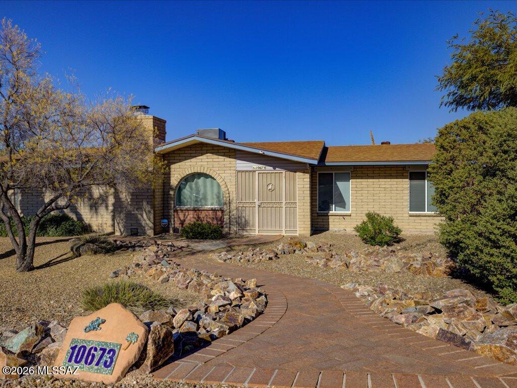This incredibly charming home sits on nearly an acre with of land with NO HOA, offering the perfect blend of comfort, privacy, and beautiful mountain views. A welcoming paver walkway leads you inside to a thoughtfully designed 3-bedroom, 2-bathroom floor plan. The spacious kitchen is sure to impress, featuring an abundance of cabinetry, stainless steel appliances, granite countertops, and an island, perfect for everyday living and entertaining. Tile flooring flows throughout the main areas, while the bedrooms and living room offer the comfort of carpet. Step outside and discover your own private retreat. Enjoy mountain views from the expansive covered patio, surrounded by low-maintenance artificial turf and fruit trees. The property also offers an extra-thick concrete driveway pad designed for RV parking. The garage provides even more functionality with built-in cabinets for convenient storage. The roof was replaced in 2020, heat pump replaced in 2020 and hot water heater replaced in 2023 for peace of mind. From the inviting interior to the spacious outdoor living areas, this home has been lovingly cared for and is ready for you to make it your own. Come see it for yourself. You'll feel right at home the moment you walk through the door!