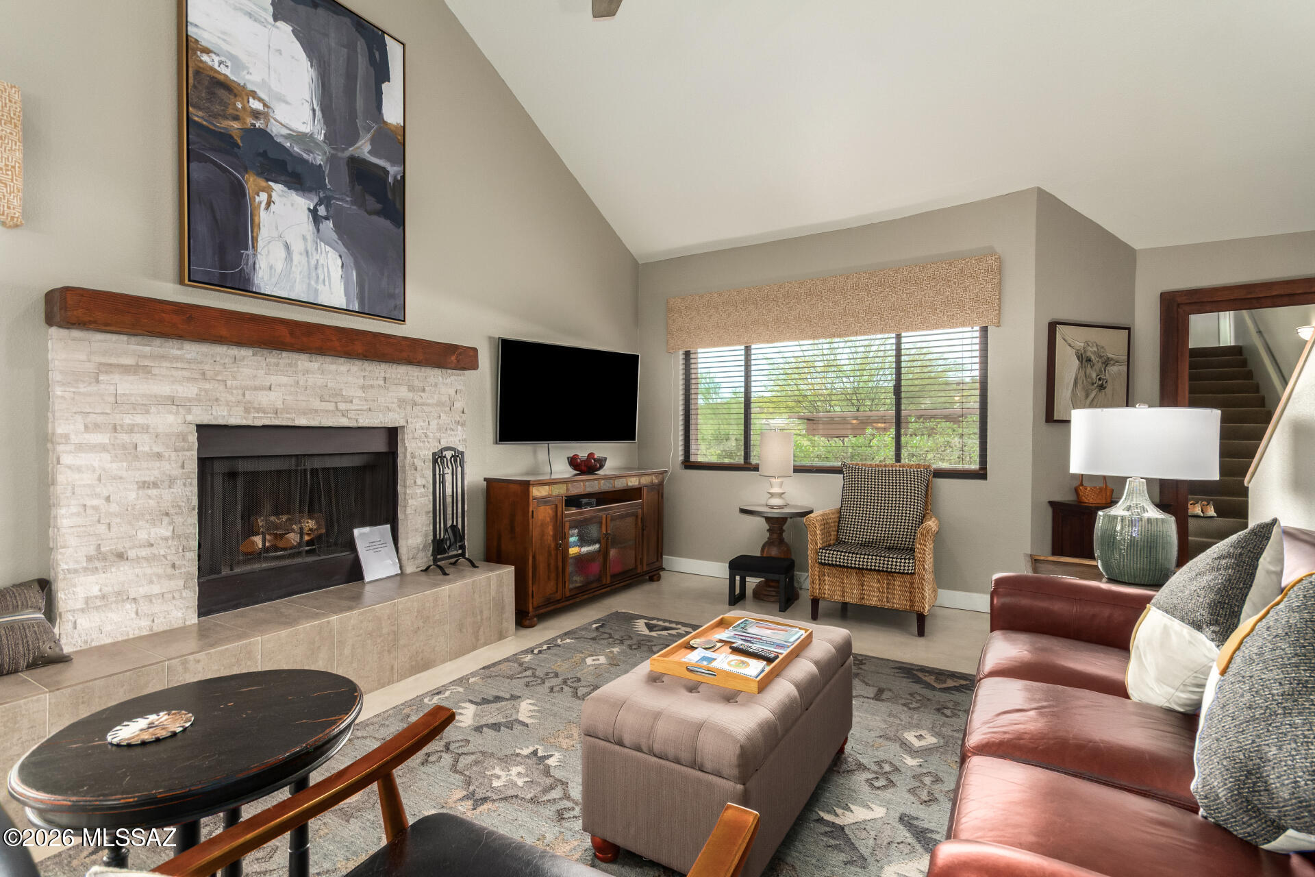 Rarely available Rose unit with no neighbors above or below! This stunning, move-in-ready home features a modern open floor plan with vaulted ceilings and a Great Room anchored by a stacked-stone wood-burning fireplace. The updated white kitchen shines with Corian, stainless steel, and a designer backsplash. Enjoy a flexible layout including a first-floor guest suite and a spacious upper-level primary retreat with a walk-in closet and executive-height dual sinks. Relax on two private patios offering both lush green views and majestic mountain vistas or retreat to the airy secondary bedroom with its own private balcony. Plus, sparkling community pool and spa, tennis courts, 2 pickleball courts, workout facilities and club house. Updated from top to bottom—this one won't last!