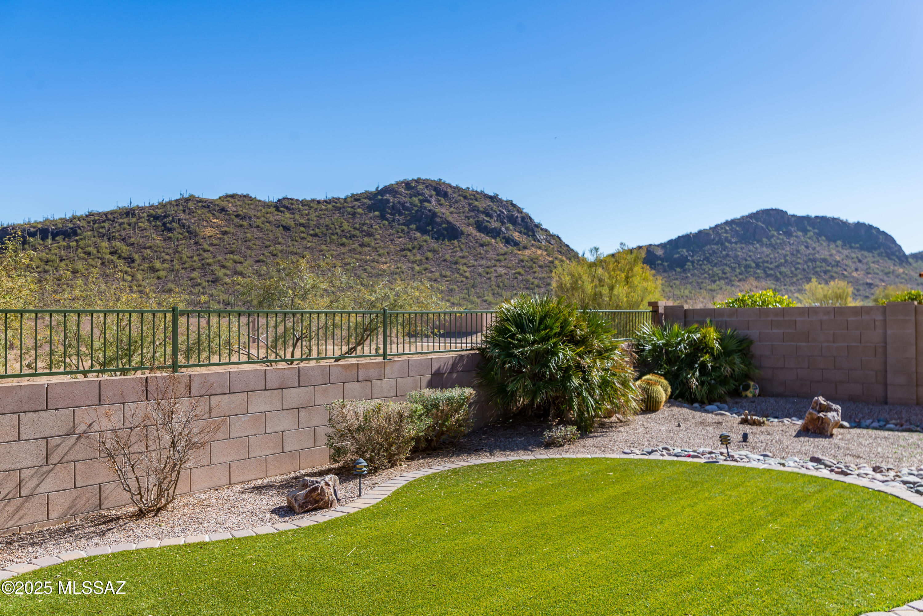 This 2,241 sf DR Horton Kramden Model is located in the master-planned           community of Saguaro Bloom. The flexible floorplan includes three bedrooms and two baths with a bonus/game room between the two guest bedrooms for a play/living area separate from the rest of the house. There is also a library/den area off the entry. The kitchen has upgraded features including granite countertops, cabinets, stainless appliances, and a large island/breakfast bar. The spacious primary suite features a sliding door to the rear yard, dual sinks, walk-in closet and step-in shower. This one-owner home has been meticulously maintained since new. The community offers many lifestyle features including parks, nature walking trails, pools, sports courts, recreation center, and splashpad play area.