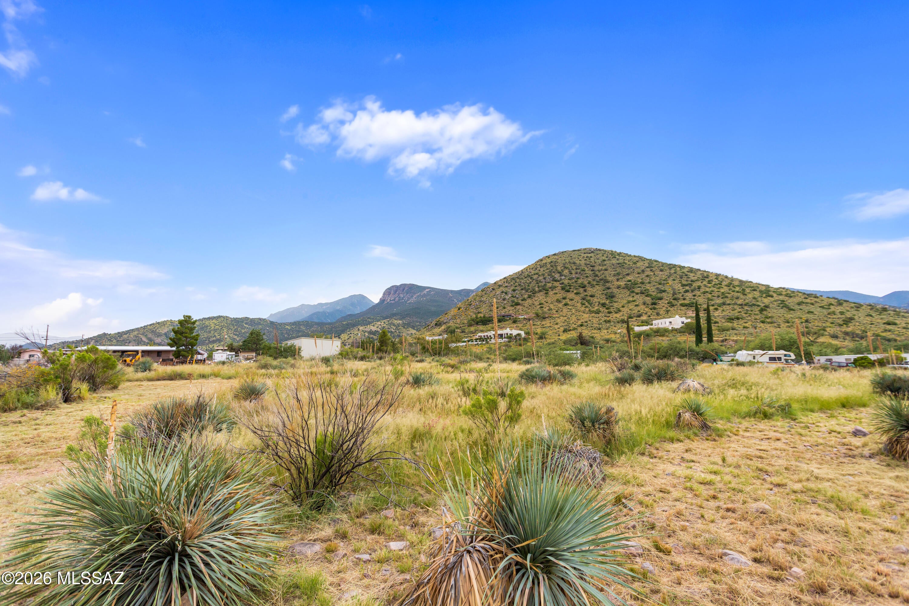 Build your vision on this beautiful, nearly one-acre lot with stunning mountain views! Whether you're planning a manufactured home or a site-built home, this property offers plenty of possibilities. A water riser is conveniently located in front of the property, with power at the property line. Enjoy wide-open skies, peaceful surroundings, and beautiful Southern Arizona scenery.