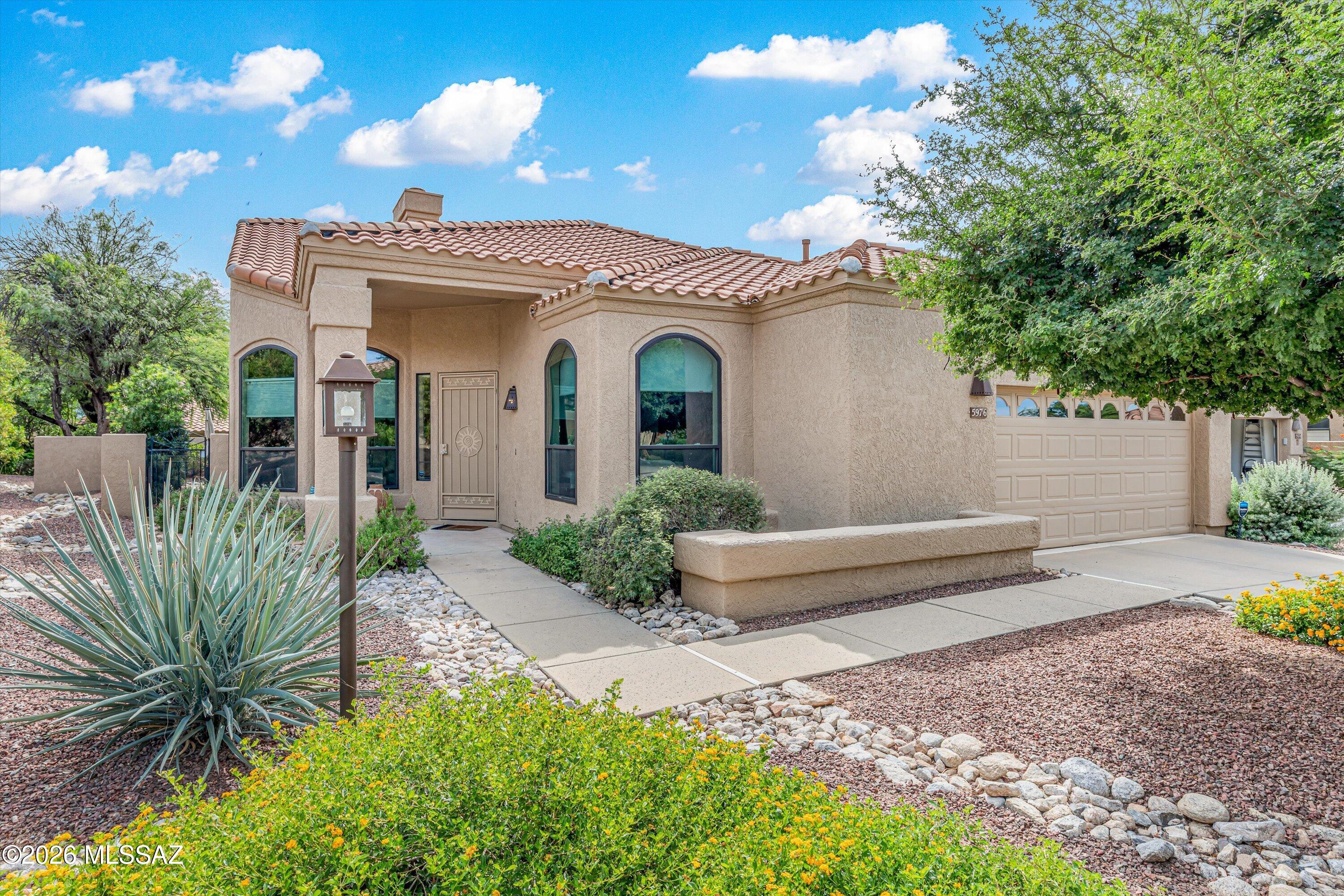 Light, bright, and wonderfully private, this coveted 3BR/2BA free-standing Golf Villa offers 2,204 SF on a peaceful cul-de-sac lot. Vaulted ceilings, a new UV-protected skylight, and generous windows fill the home with natural light. The kitchen features granite tile counters, custom cabinetry, glass tile backsplash, and stainless appliances. The primary suite includes a rain-glass shower and California Closet doors. Recent improvements include a new roof, west-side windows, new irrigation, and rattlesnake-proof gating. Two 16-SEER HVAC systems were replaced in 2019. A 220V garage circuit provides EV charging capability. Enjoy a peaceful private patio and convenient access to the Golf Villas pool and spa.
