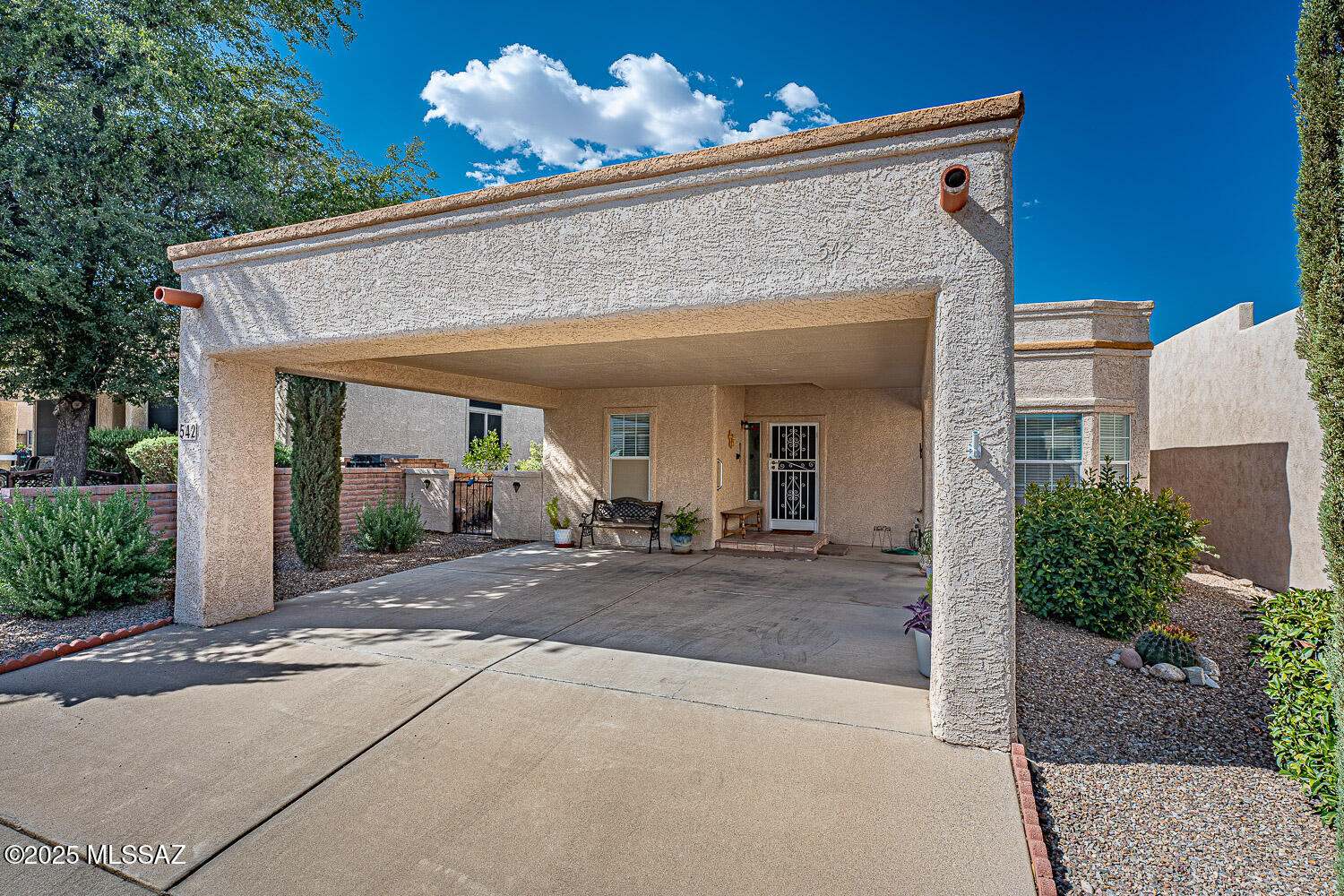 Welcome to this delightful furnished 2-bedroom, 2-bathroom retreat, perfectly situated in the heart of Green Valley--without the added cost of GVR! A fantastic opportunity you won't want to miss! This charming residence offers a bright and well-planned interior ideal for both year-round living and seasonal getaways. Step inside to discover a floor plan filled with natural light. The living room and bedrooms feature warm laminated wood flooring, while the kitchen and bathrooms are finished with practical ceramic tile. The updated kitchen includes a gas range, three-year-old appliances, ample cabinetry, and a breakfast bar that opens to the dining area--complete with a vintage stained glass hanging lamp. The Arizona room extends your living area, creating a versatile space to relax, read, or entertain guests. With a Trane HVAC system installed in 2020 and under a maintenance program, your comfort is assured year-round. The entire home was re-plumbed in 2020, and the roof was recently re-coated in 2025, offering peace of mind and low-maintenance ownership. Additional features include all window treatments, vintage stained glass in the hallway and HVAC ducts have been cleaned. Outdoors, enjoy mature landscaping and four fruit trees that bring beauty and shade to the backyard. A handy shed provides additional storage, and the 2-car carport offers easy access and convenience. Great location just a short distance from the community clubhouse, park, and pool/spa and only minutes from shopping centers, gas stations, and easy access to I-19 this home offers a well-connected and balanced lifestyle.