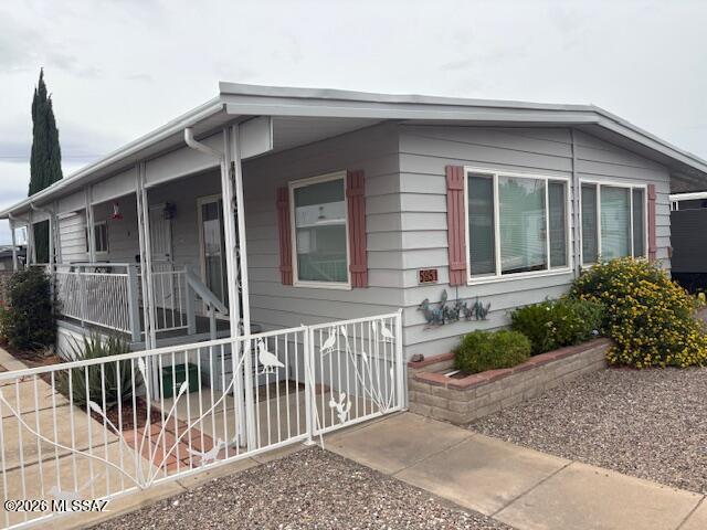 Nice mostly furnished north facing 2 bedroom 2 bath home close to golf course and amenities with great mountain views! East side deck was added recently with Trex material creating a comfortable outside sitting area. A new walk-in shower was also added in the primary bath. Living room and dining in the front with ample windows for viewing. Windows also have newer blinds. Newer HVAC system is 4 years old. Fenced in area on east side for your pet. Located in an active 55+ community, the HOA fee includes unlimited golf, tennis, pickleball, shuffleboard, pools, spa, fitness center, trash service, and much more. Best of all--you own the land. This is carefree living at its finest.